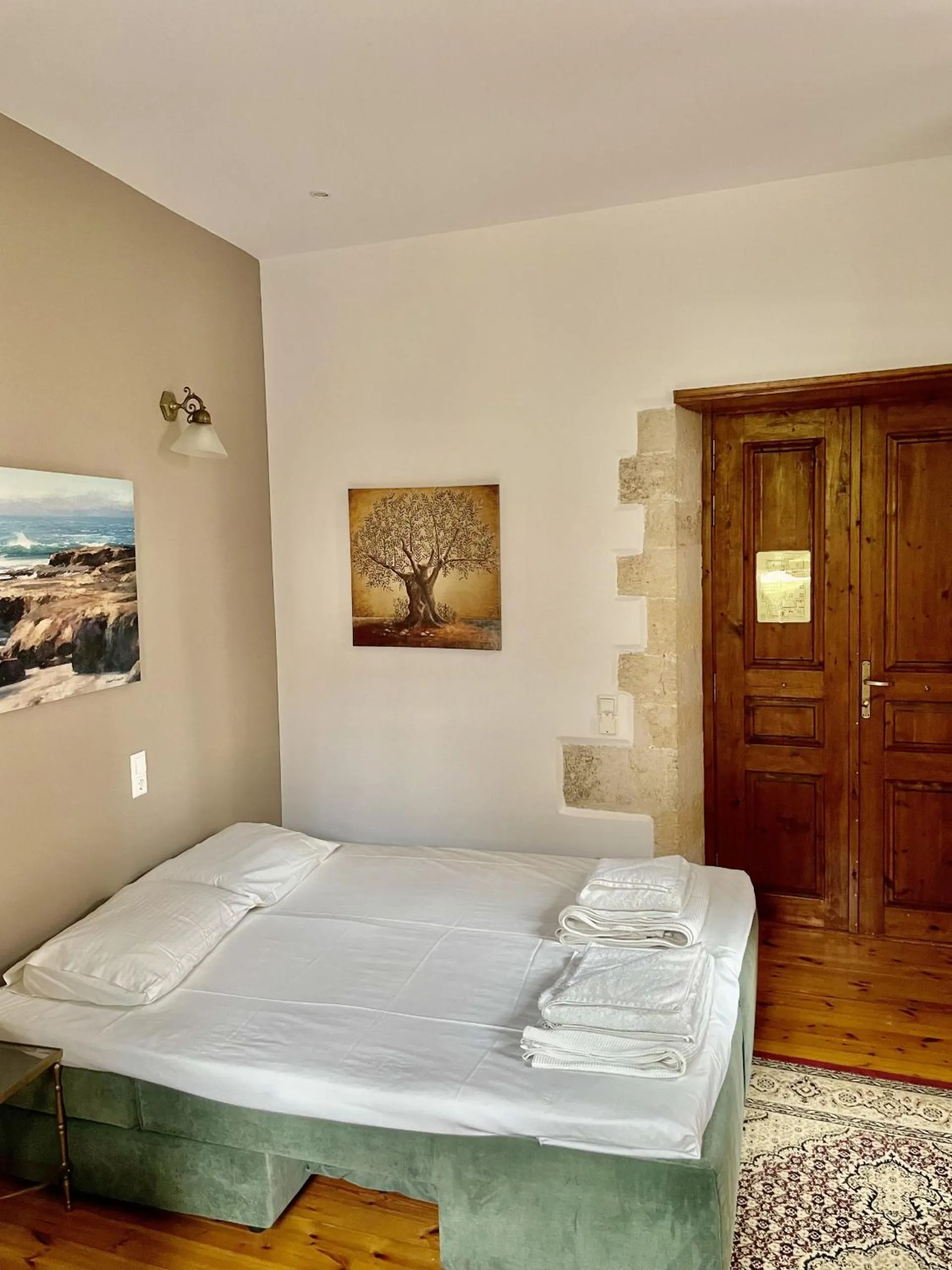 Bed in Erietta Suites