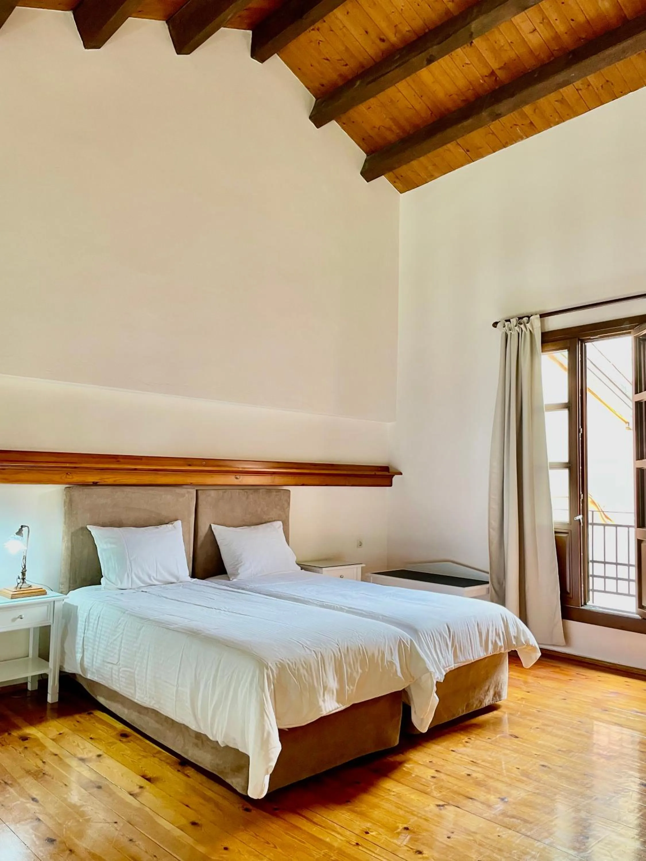 Bed in Erietta Suites