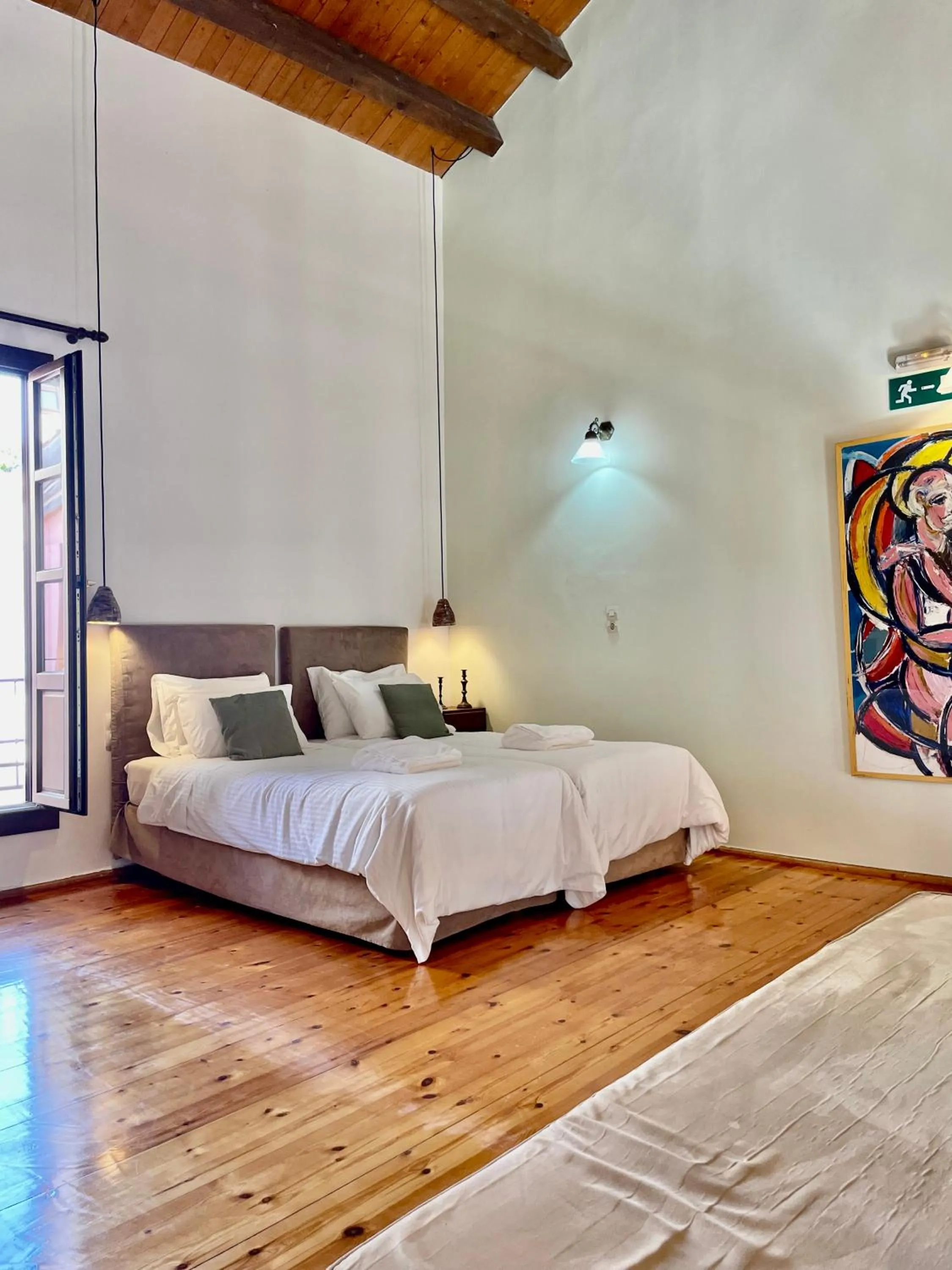 Bed in Erietta Suites