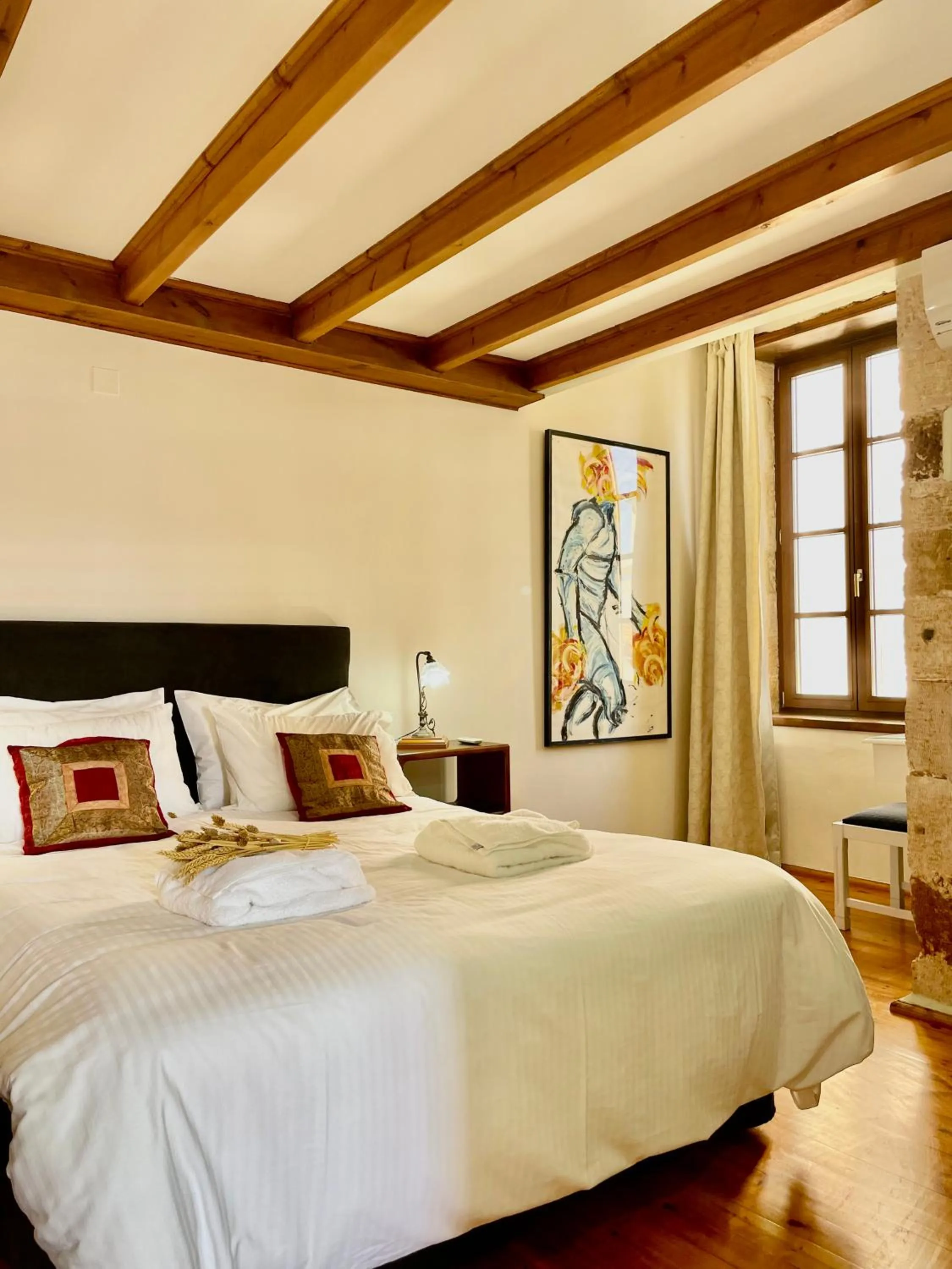 Bed in Erietta Suites