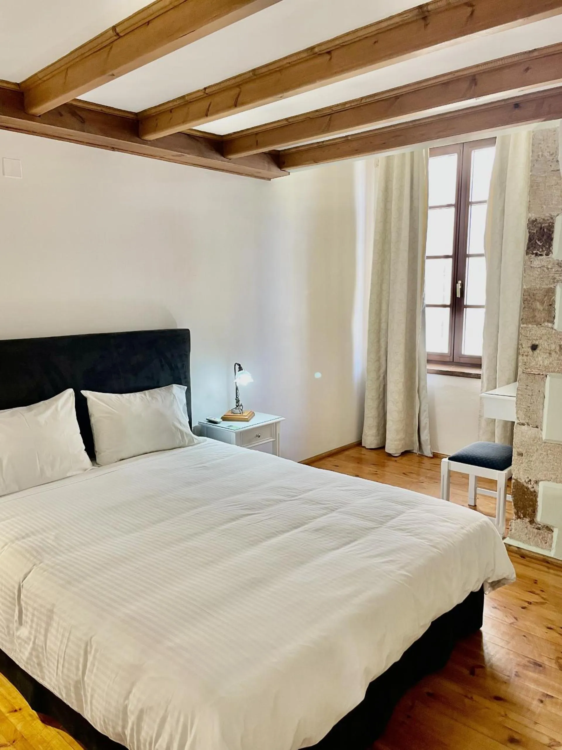 Bed in Erietta Suites