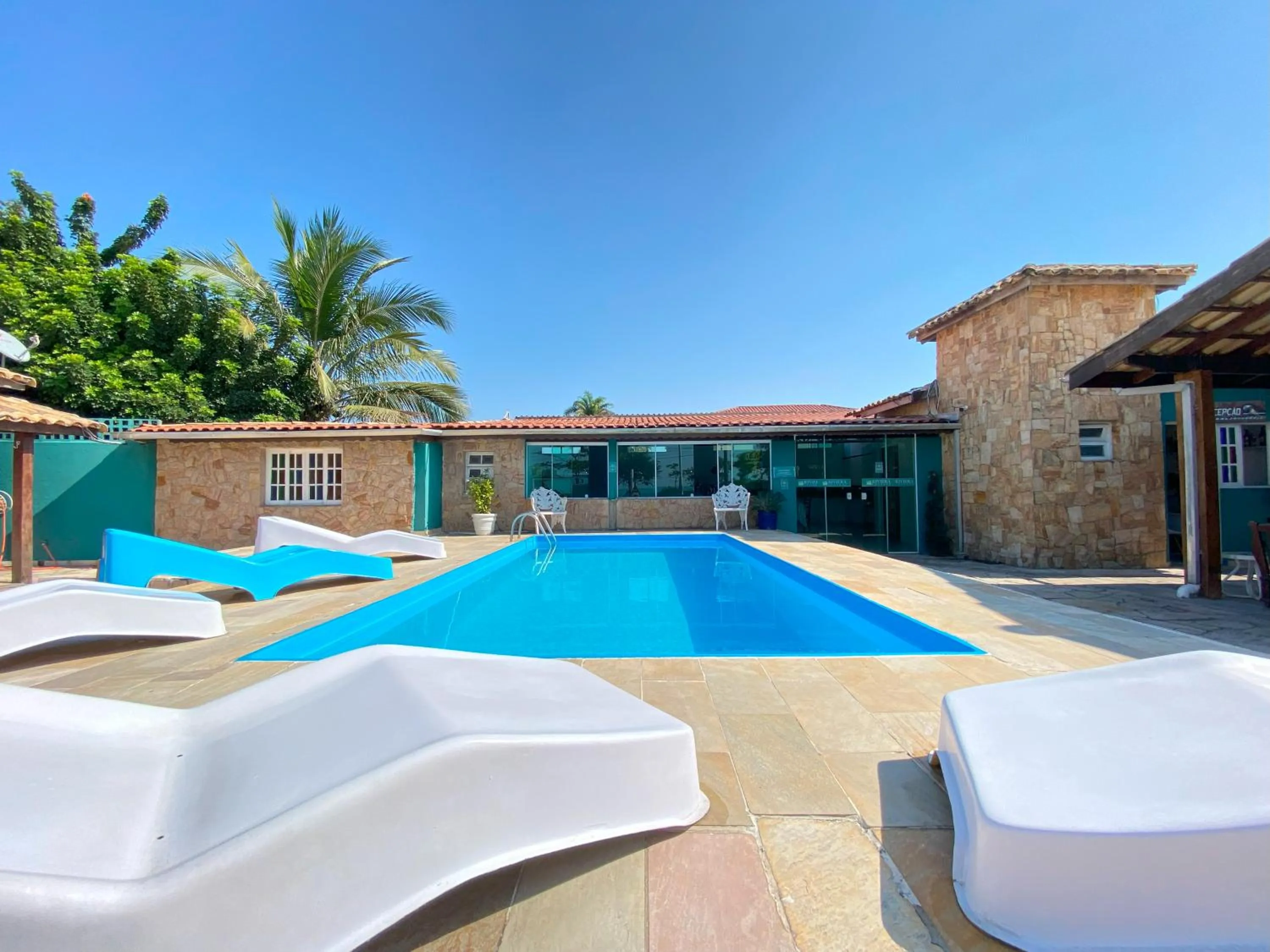 Swimming pool in Pousada Riviera Caragua