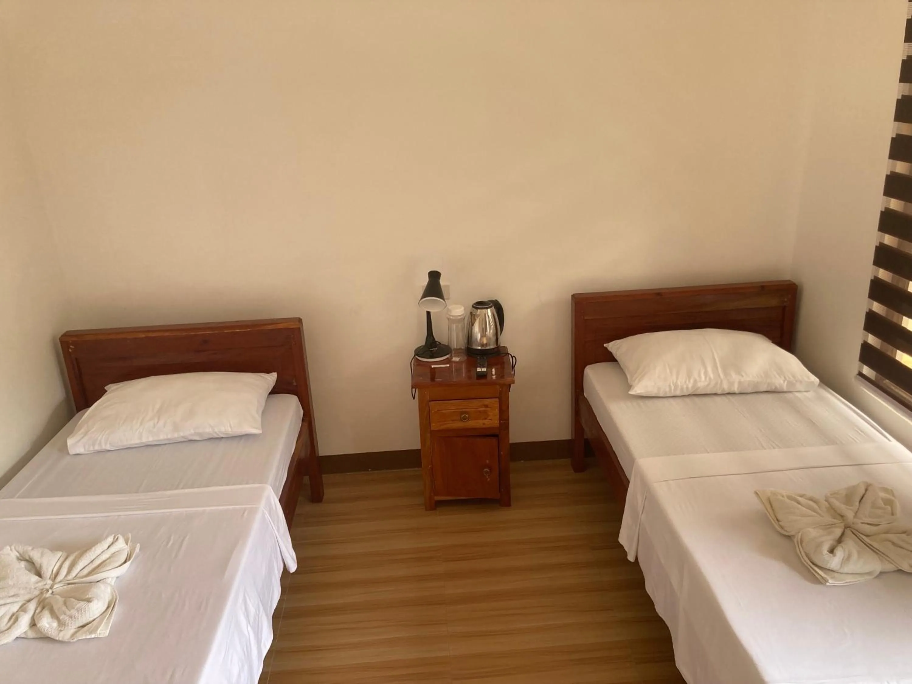 Bed in Baki Divers and Beach Resort
