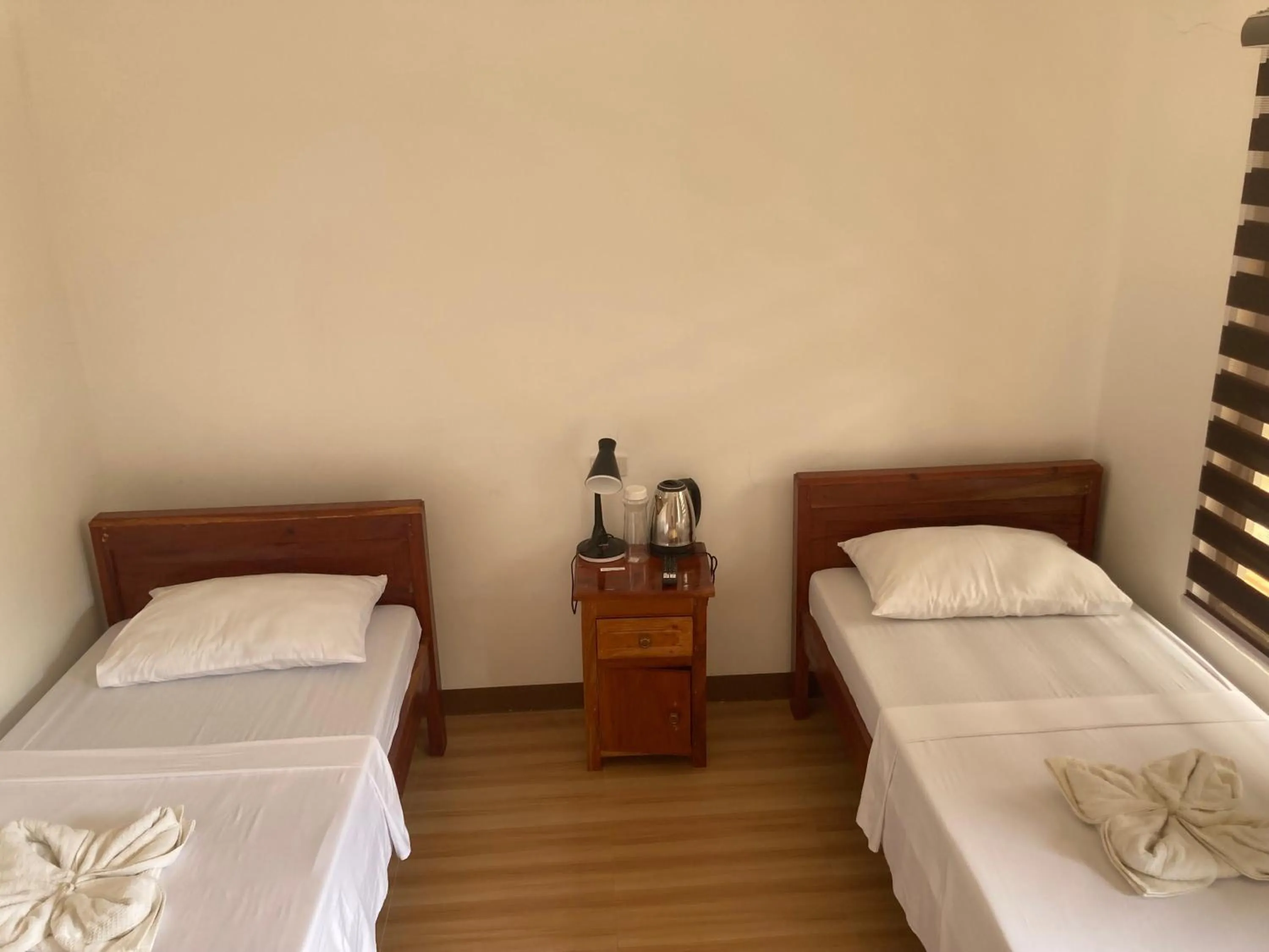 Bed in Baki Divers and Beach Resort