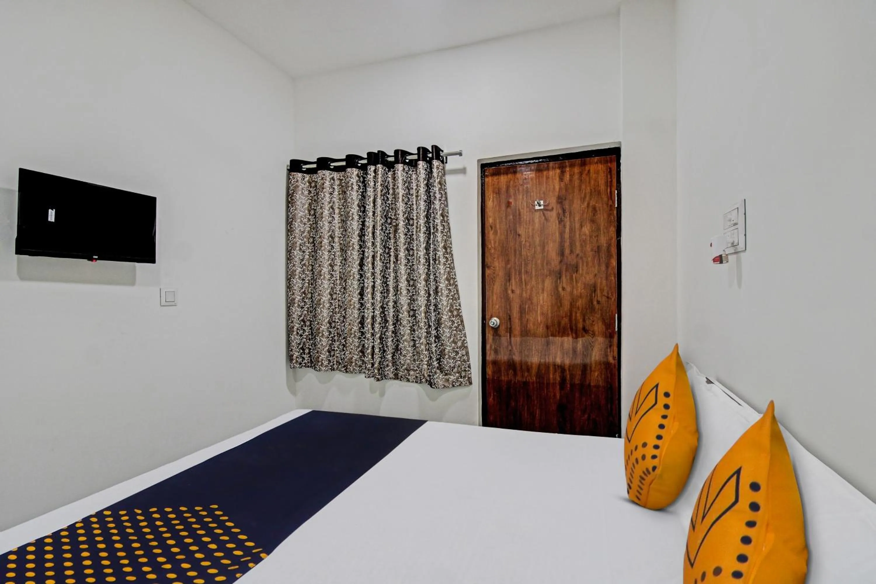 Bedroom in Spot On Tulsi Stay Inn