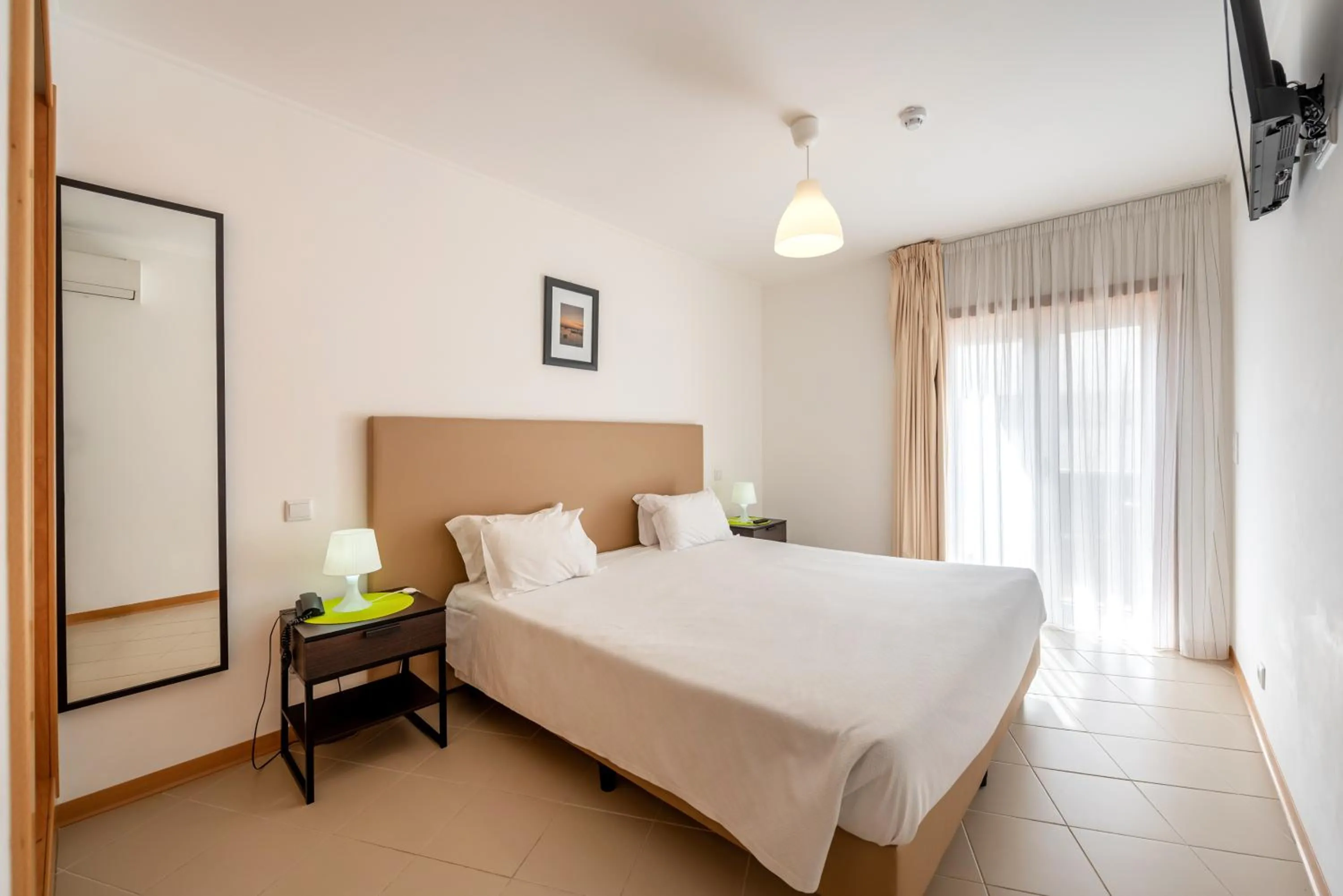 Bedroom, Bed in Apartamentos Mirante da Rocha