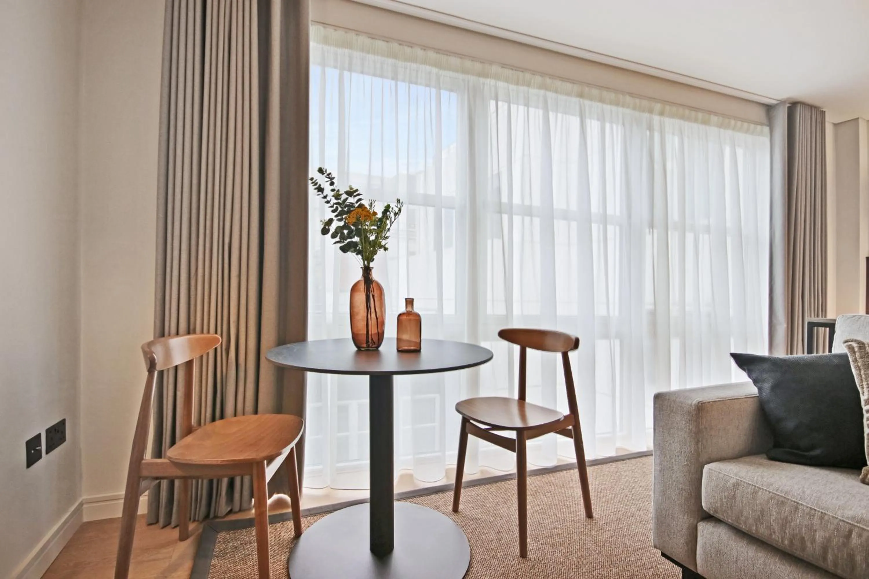 Seating area in Bow Lane by Aeria Apartments