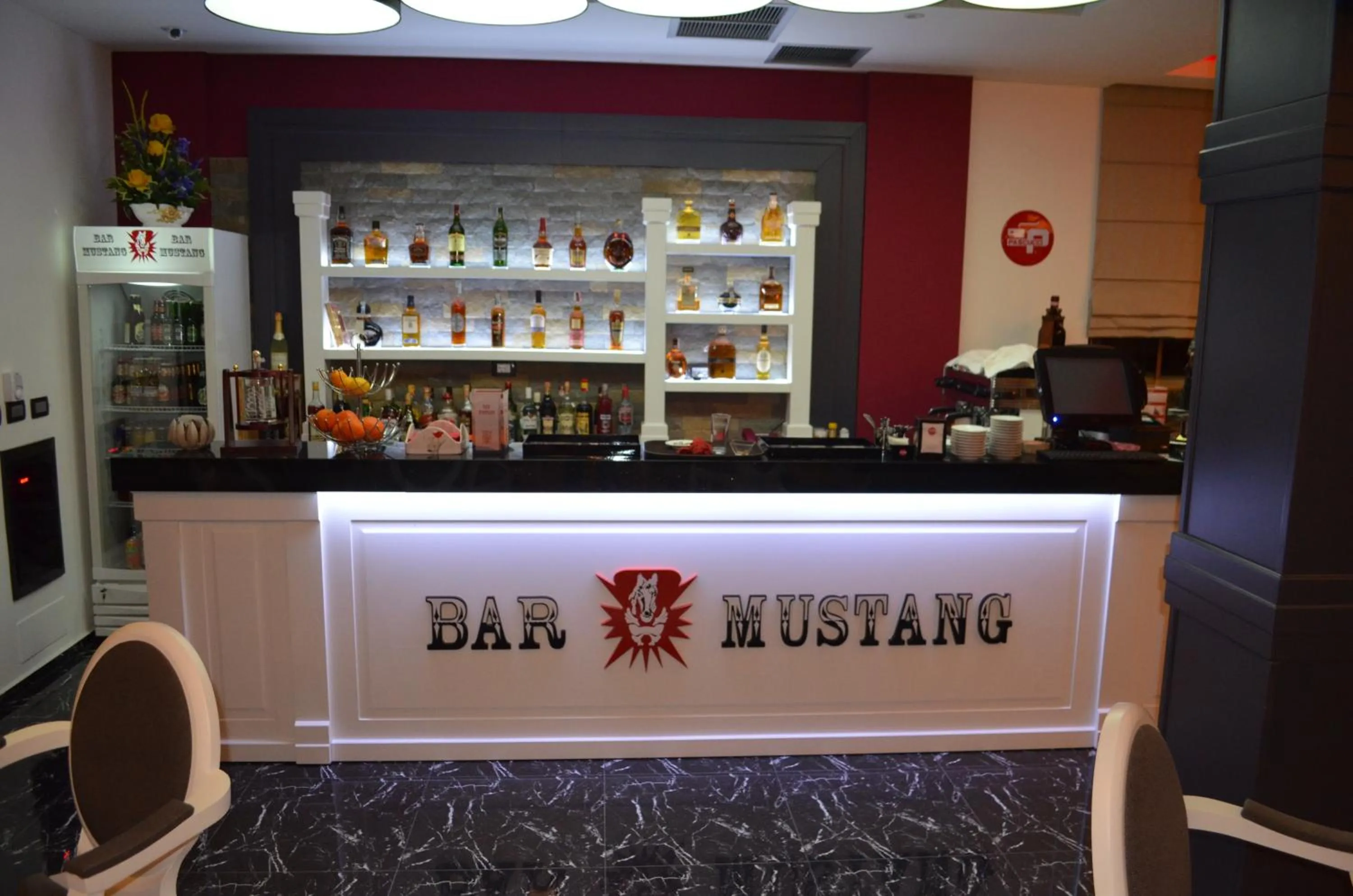 Property logo or sign in Hotel Mustang