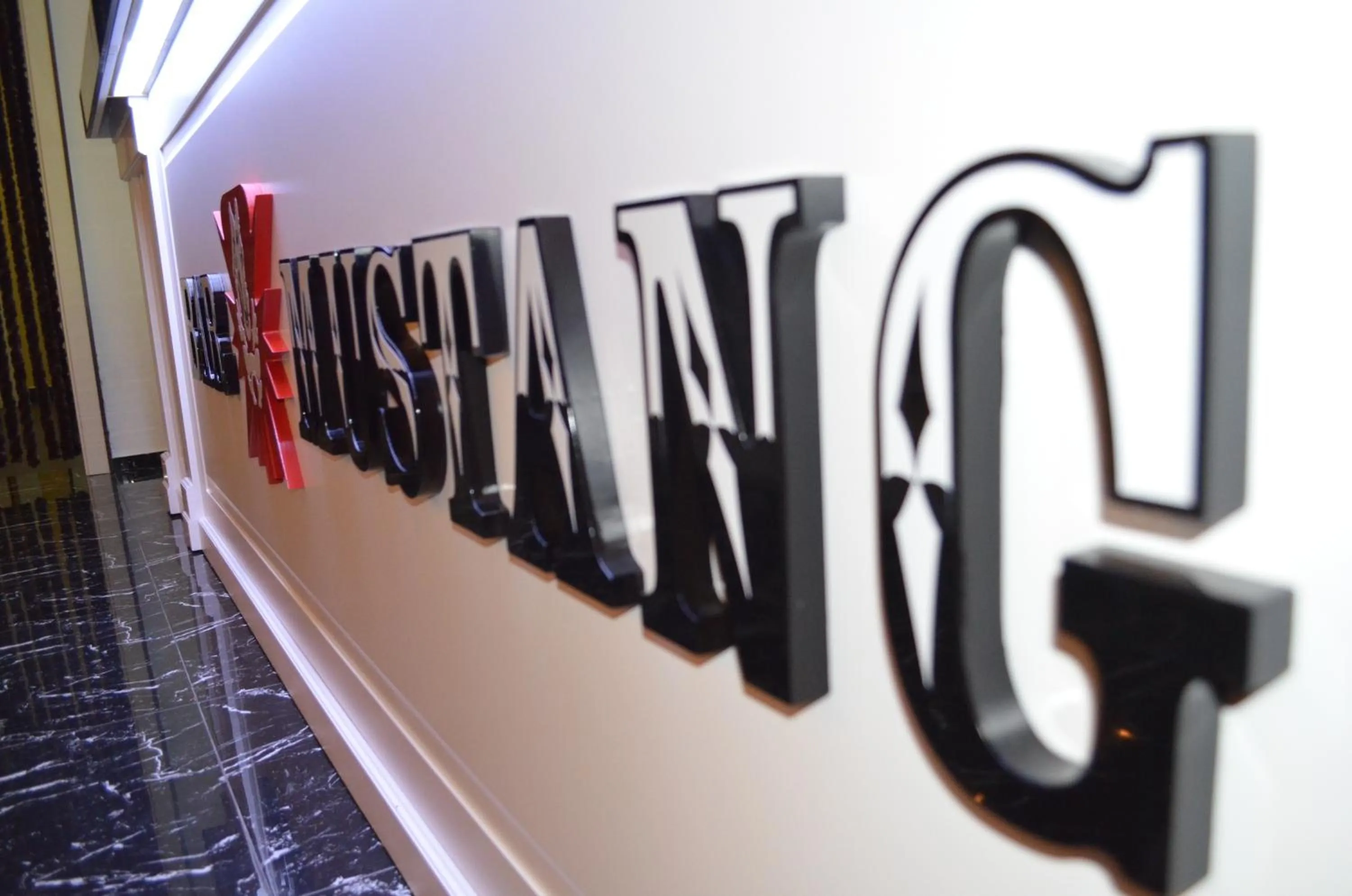 Property logo or sign in Hotel Mustang