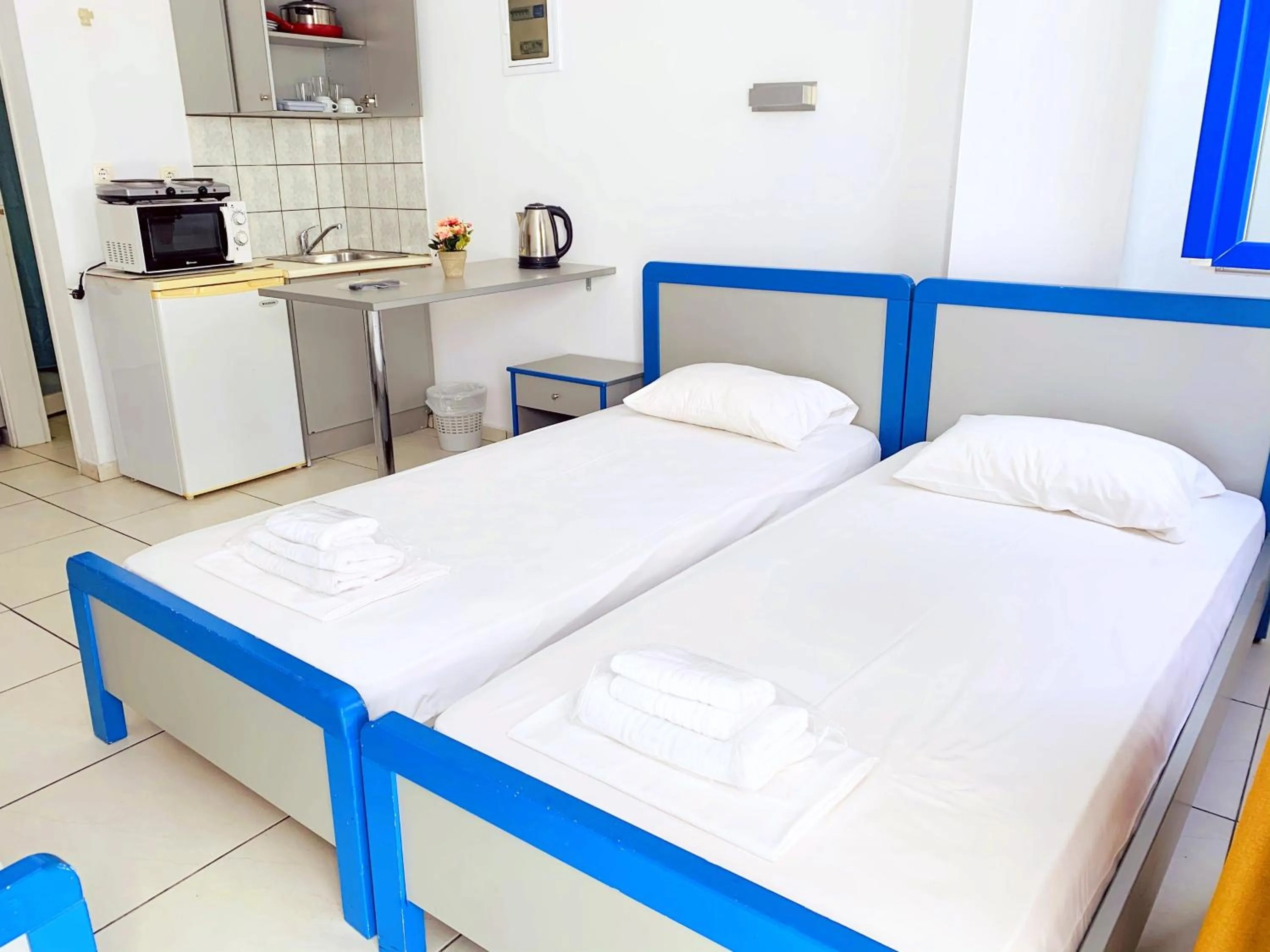 Bed in Kassavetis Center - Hotel Studios & Apartments