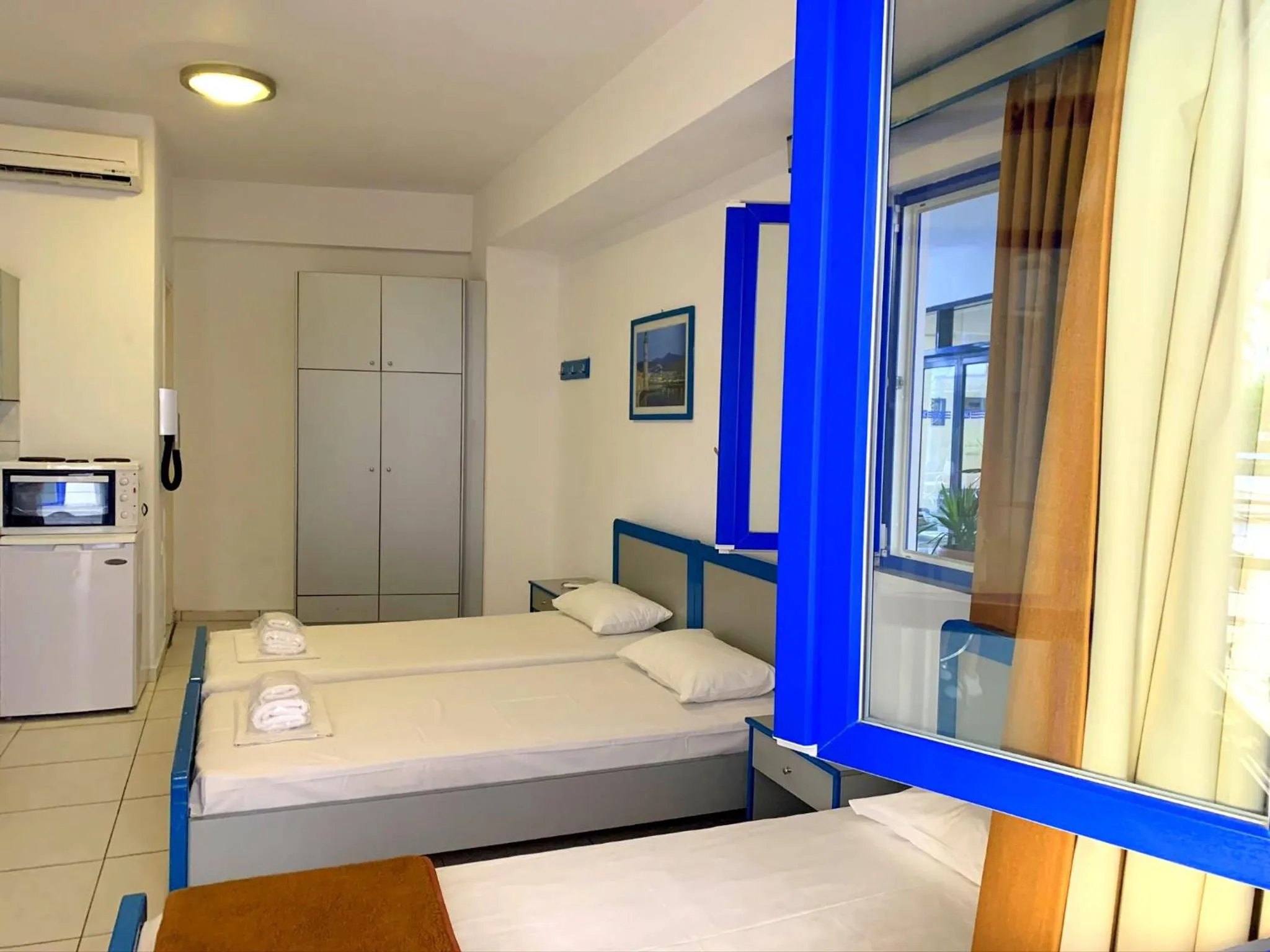 Bed in Kassavetis Center - Hotel Studios & Apartments