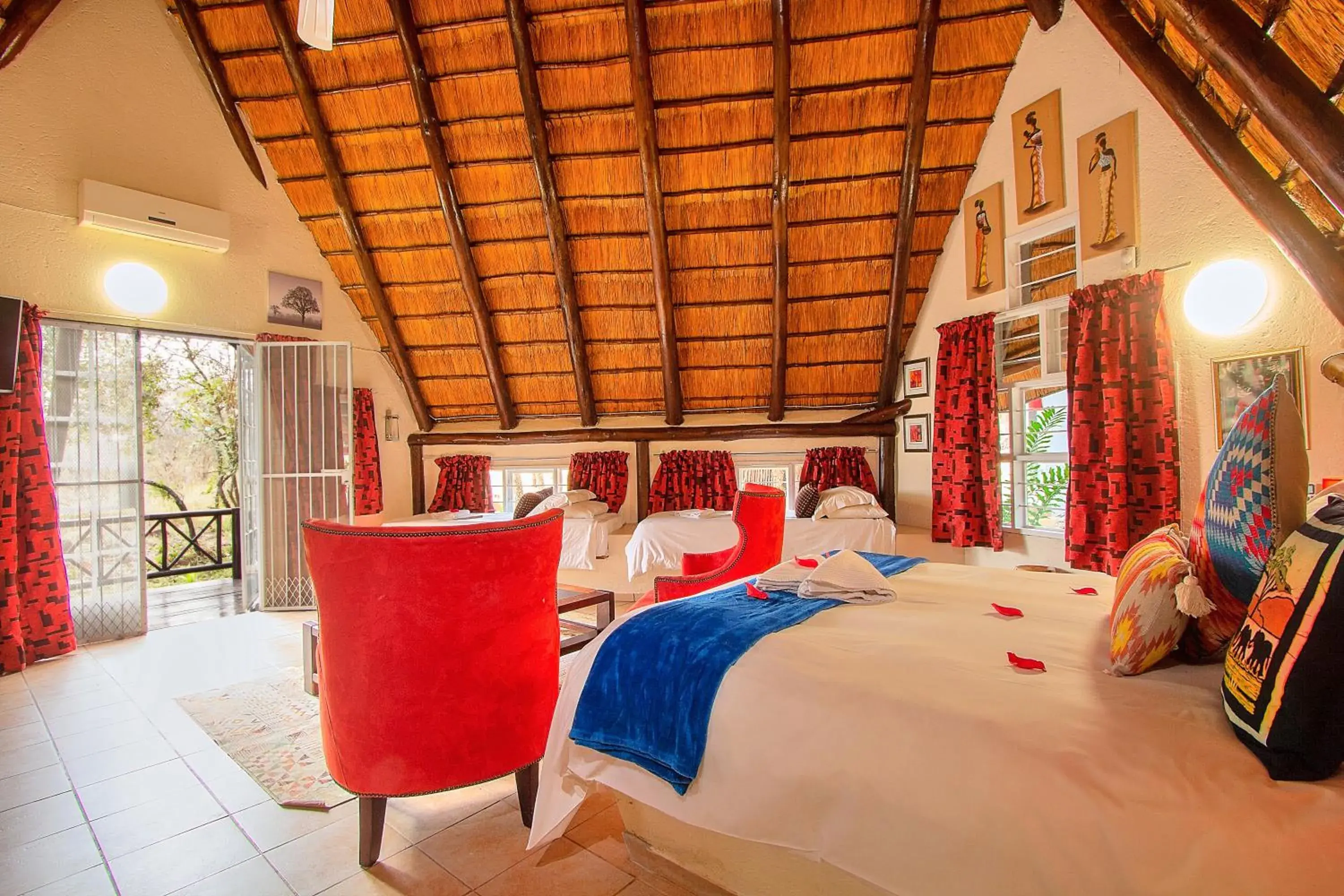 Seating area, Bed in Royal Marlothi Kruger Safari Lodge and Spa Seating area, Bed in Royal Marlothi Kruger Safari Lodge and Spa