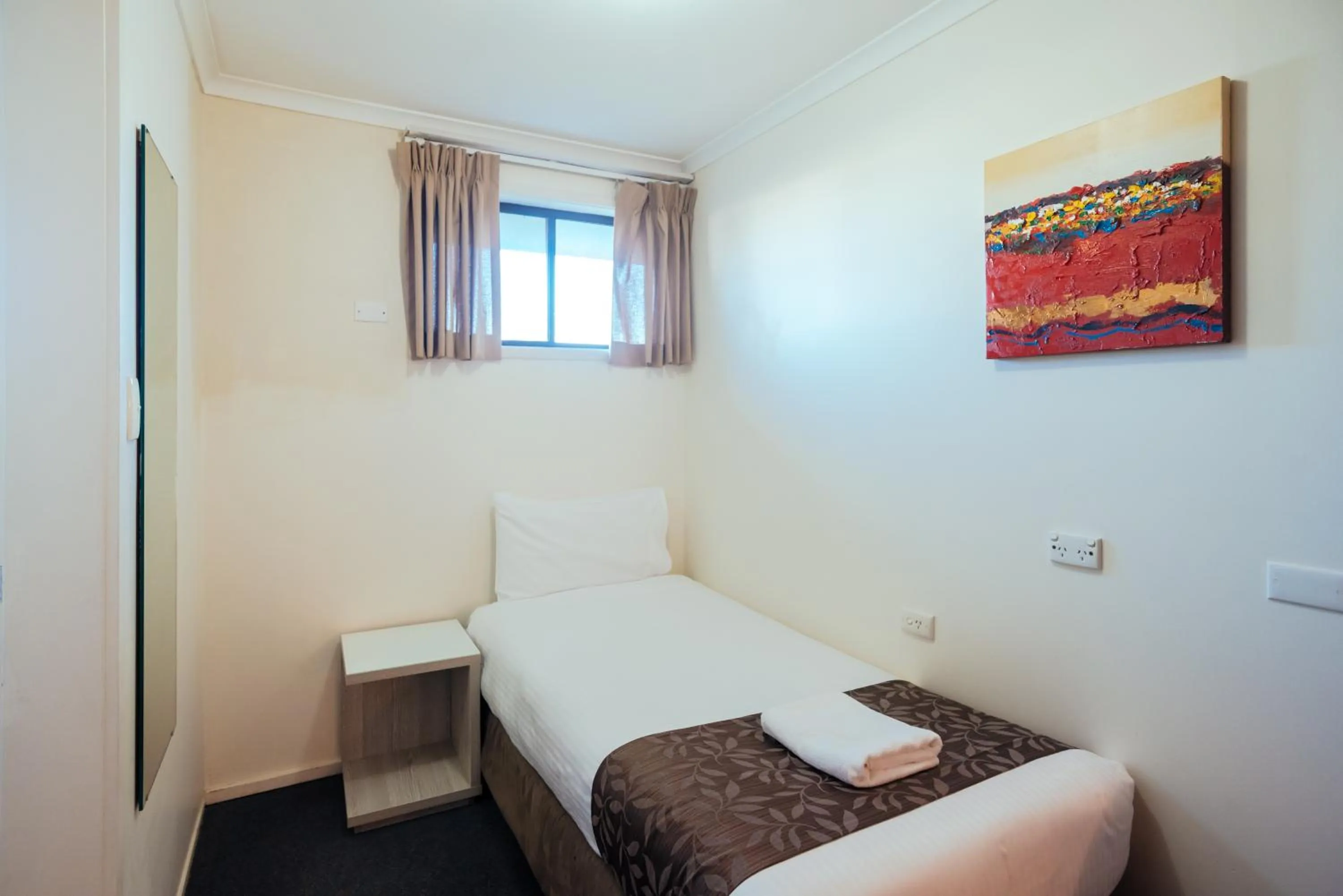 Bed in Coffs Windmill Motel