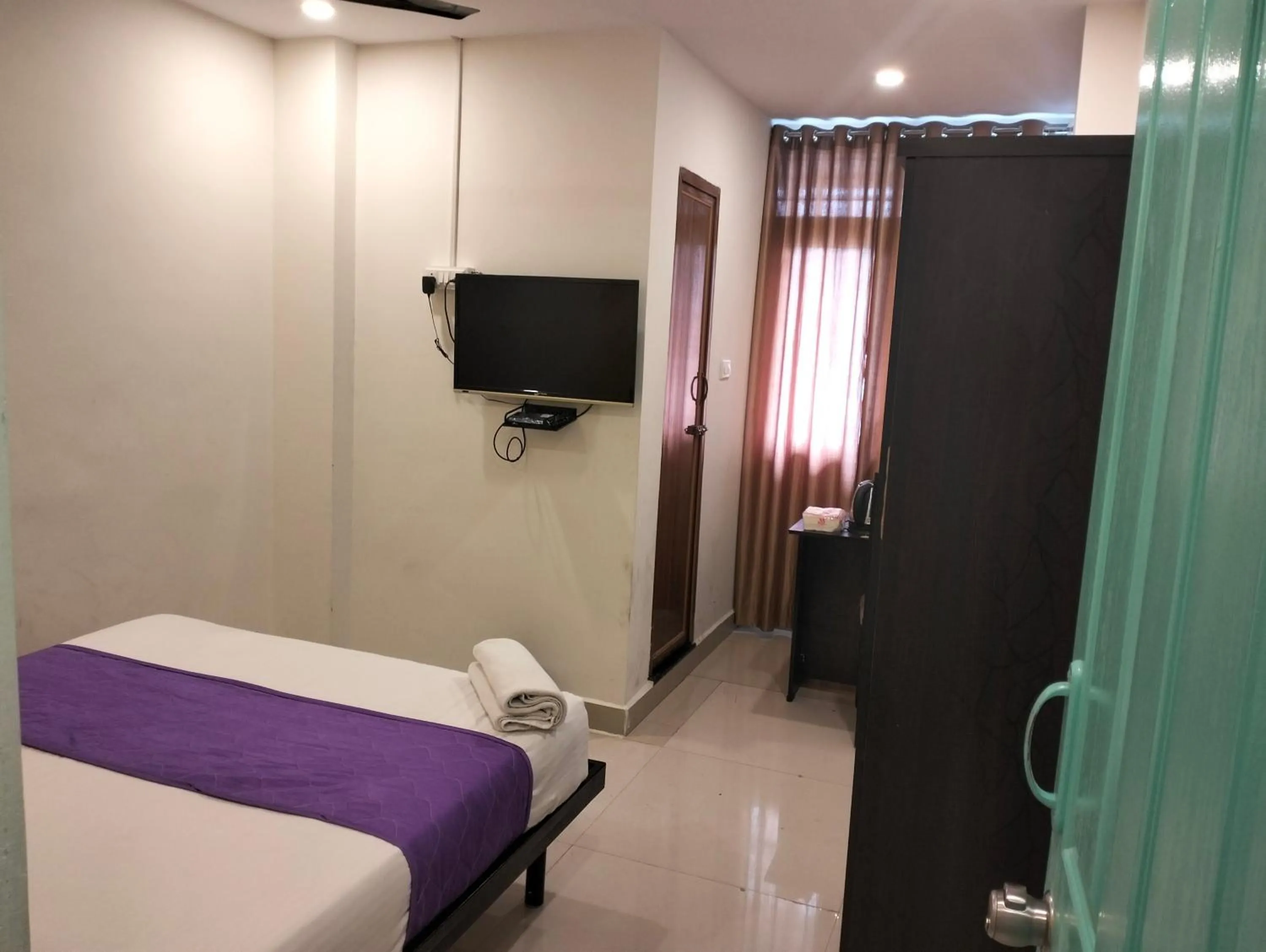 Bed in Hotel SY Comforts