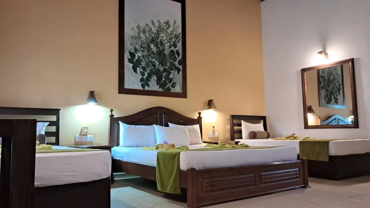 Bed in Jasmin Villa Ayurveda Resort