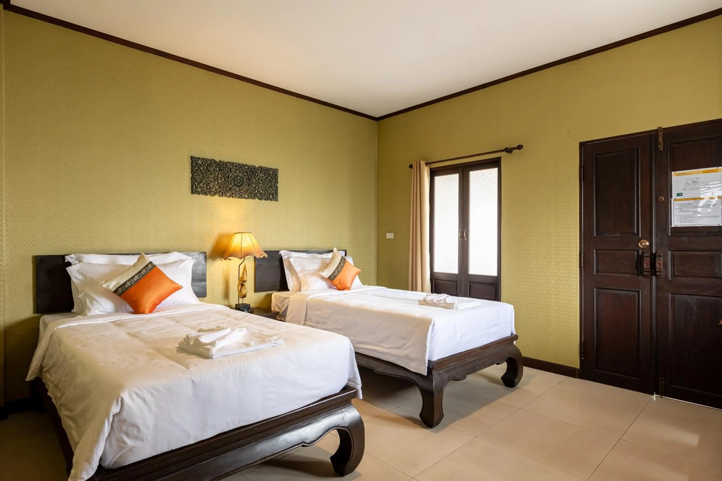 Bed in Na Thapae Chiangmai Hotel