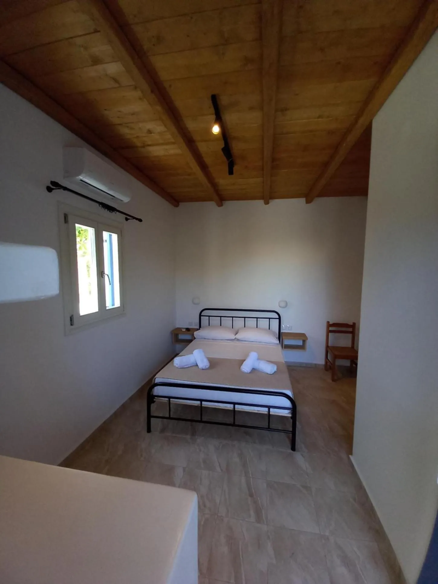 Bed in Miltiadis Apartments