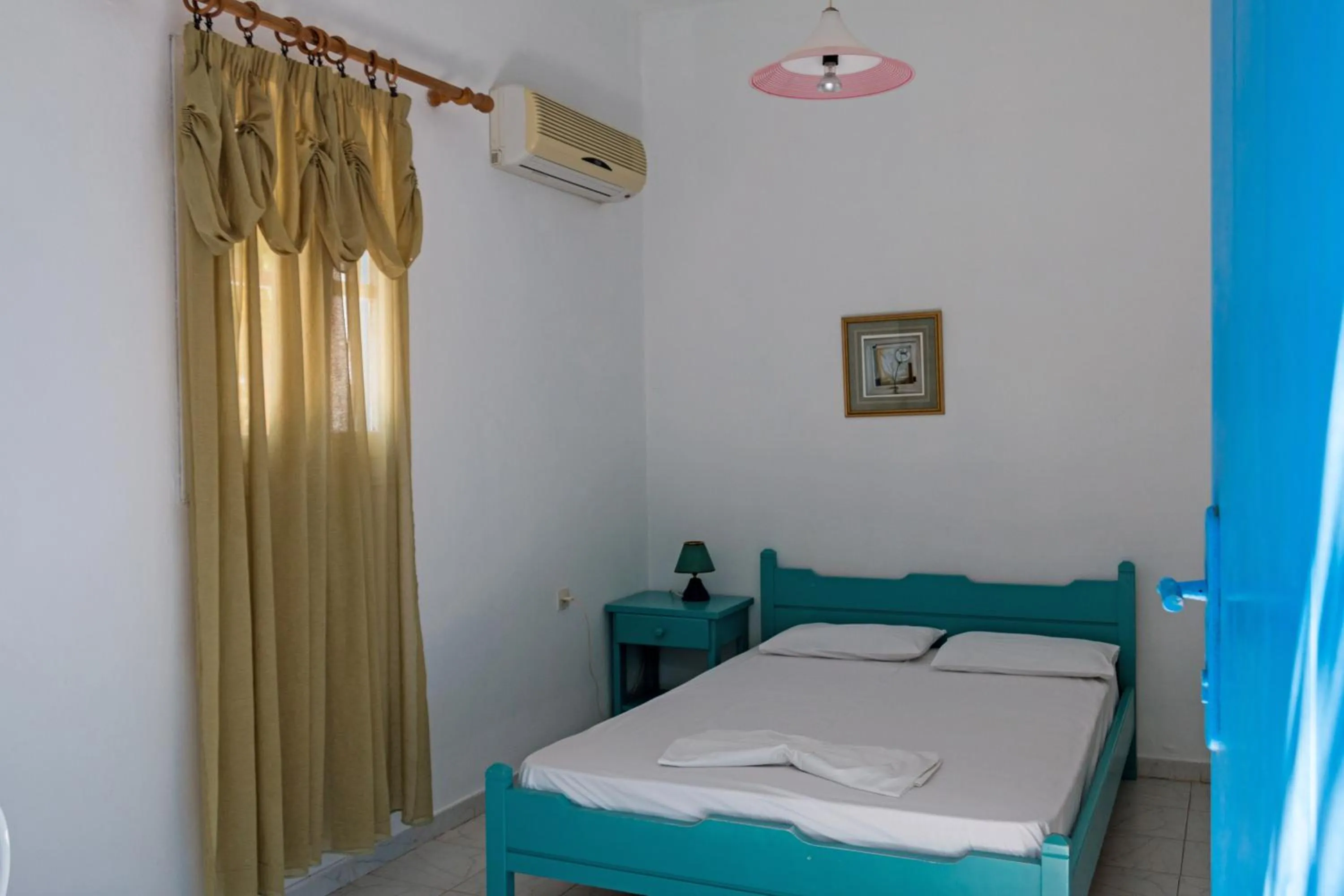 Bed in Miltiadis Apartments