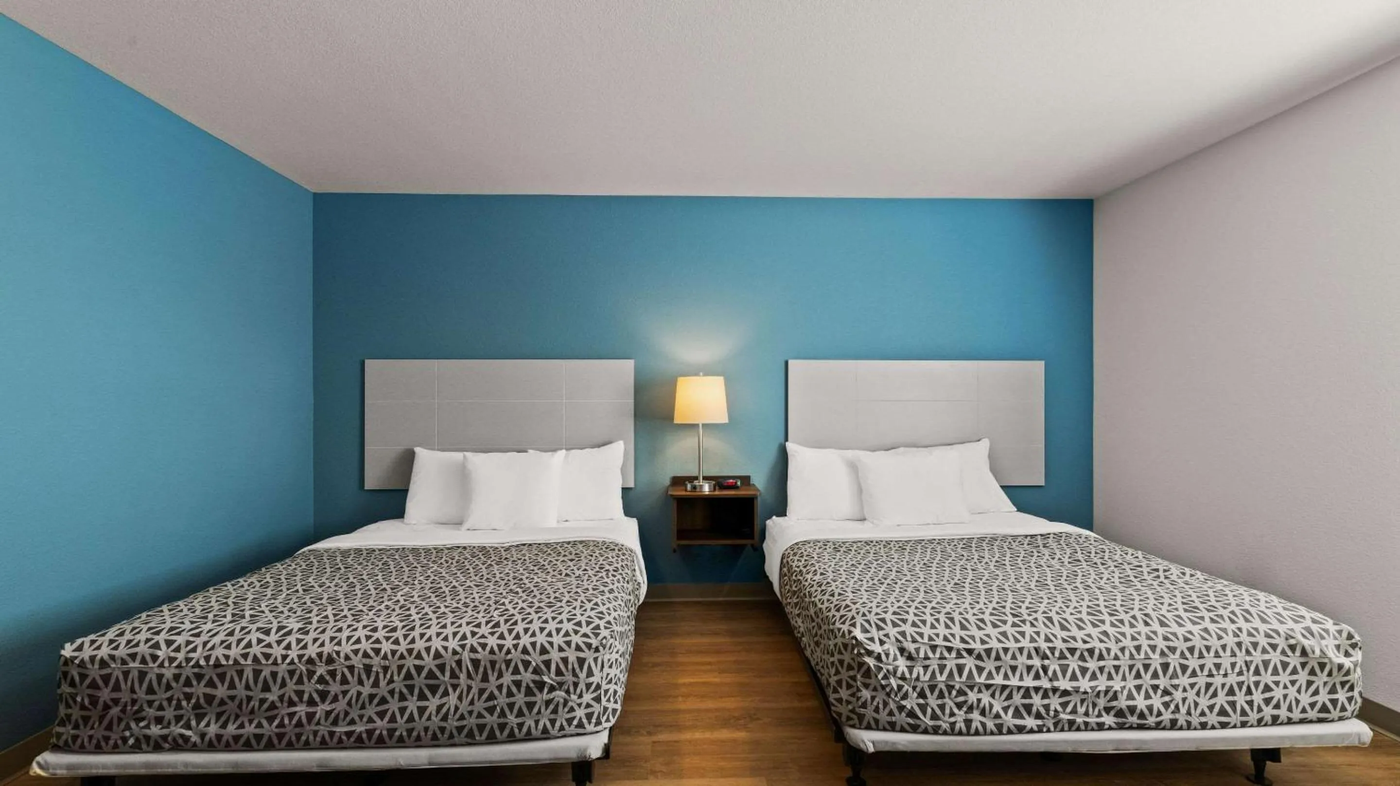 Bedroom, Bed in WoodSpring Suites Greeley