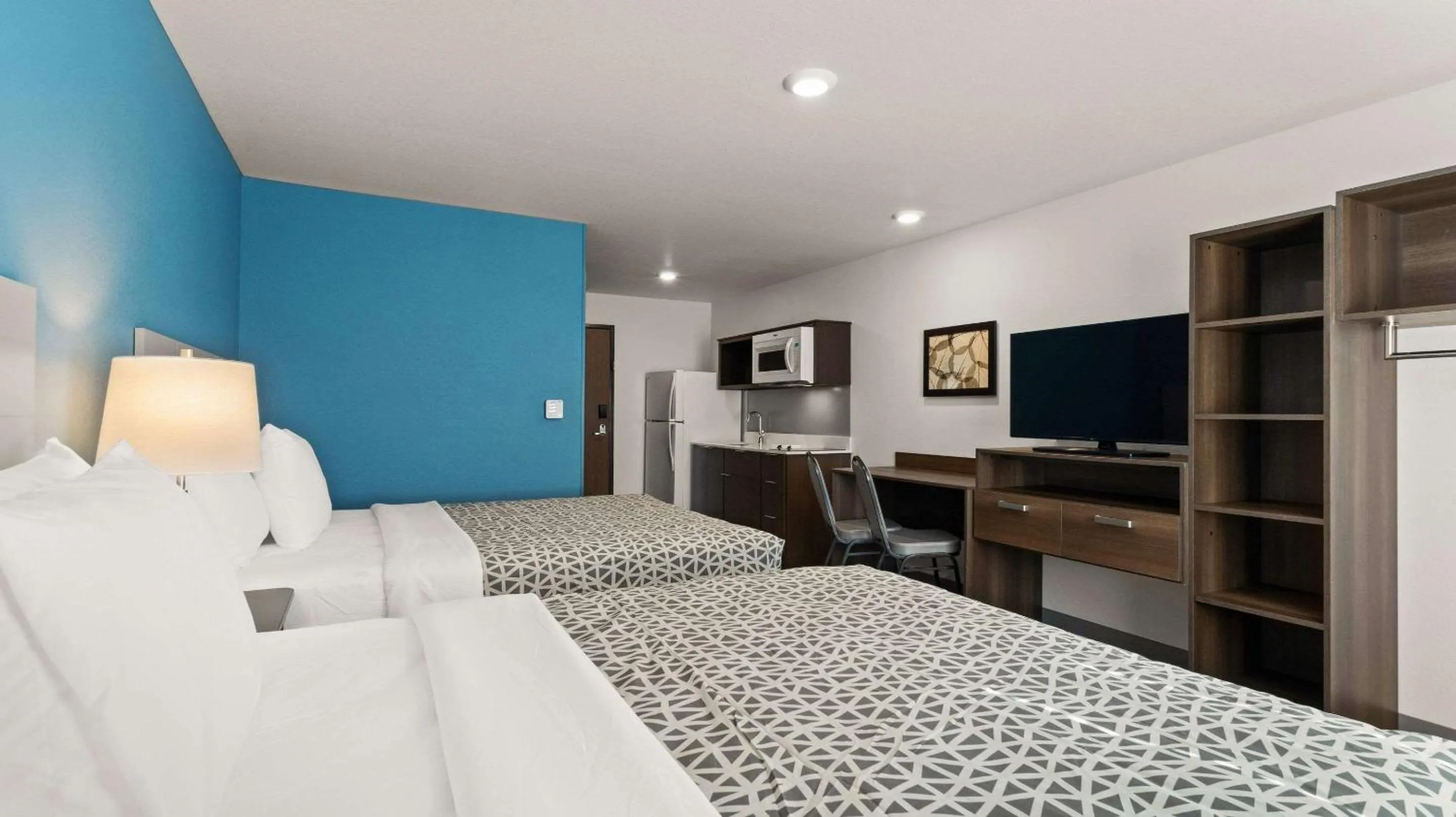 Bedroom, Bed in WoodSpring Suites Greeley