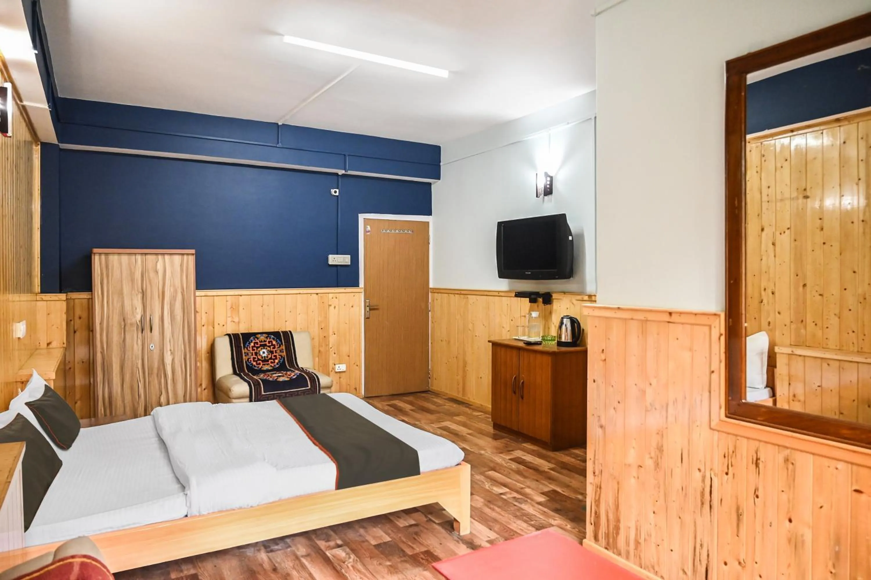 Bedroom in Hotel O Kaizen Residency