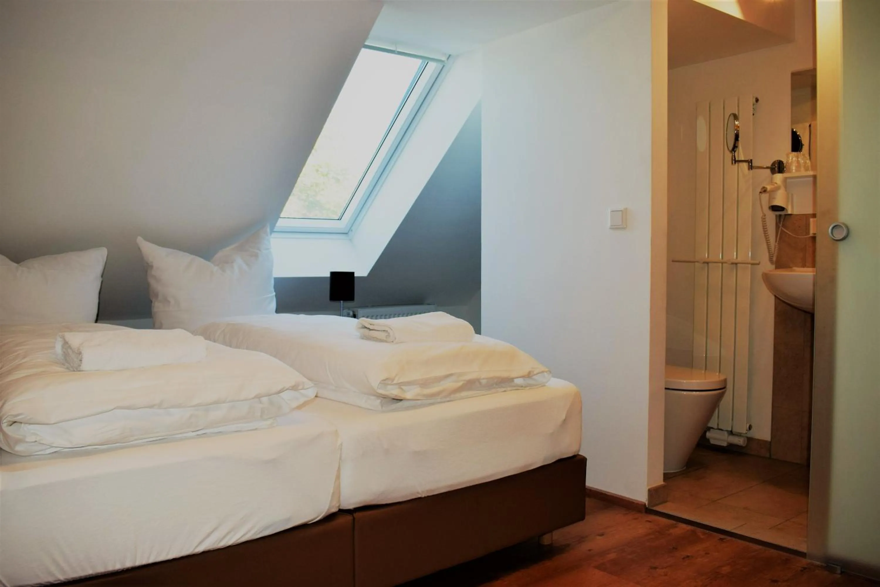 Photo of the whole room, Bed in Hotel Stanglbräu