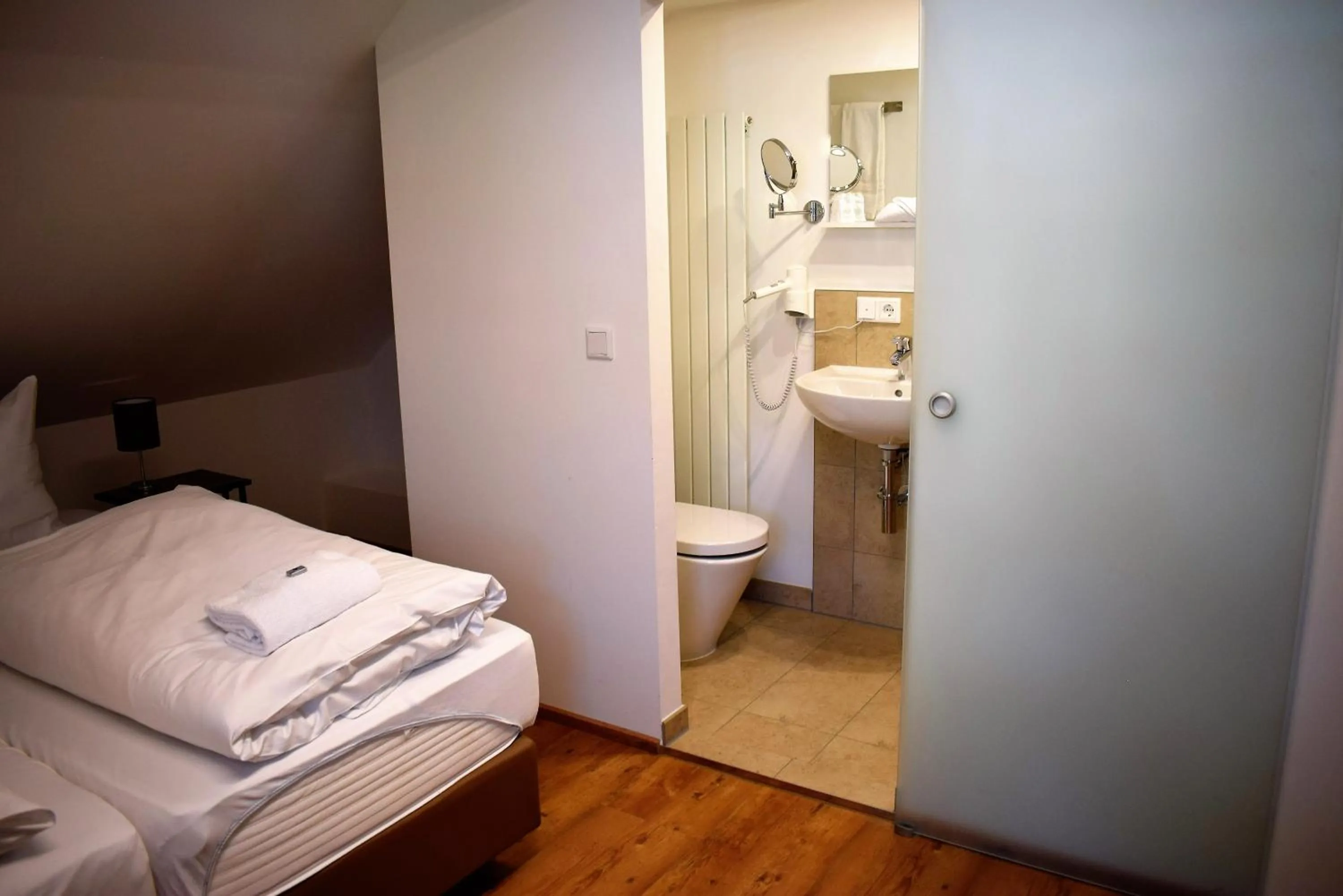 Bathroom, Bed in Hotel Stanglbräu