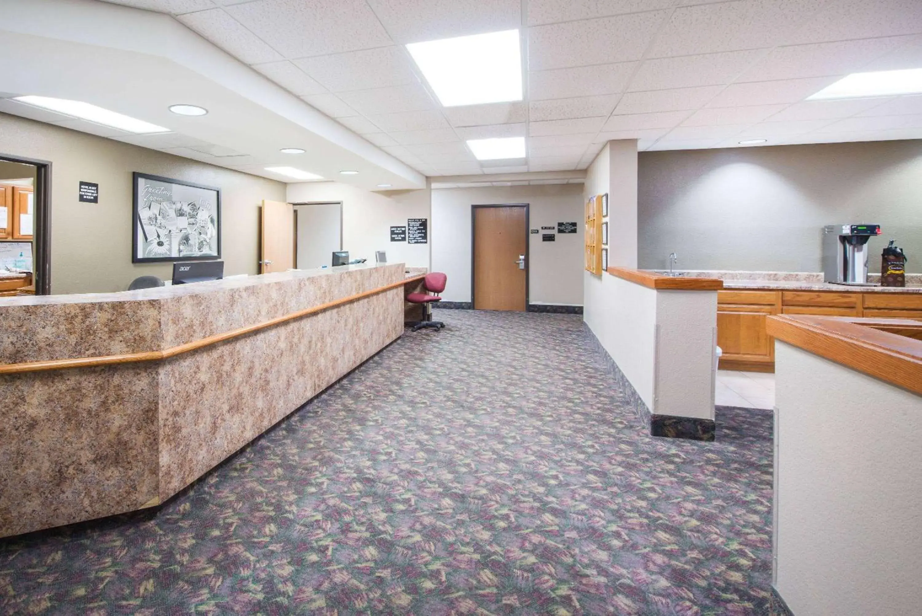 Lobby or reception in Super 8 by Wyndham Iola KS Lobby or reception in Super 8 by Wyndham Iola KS