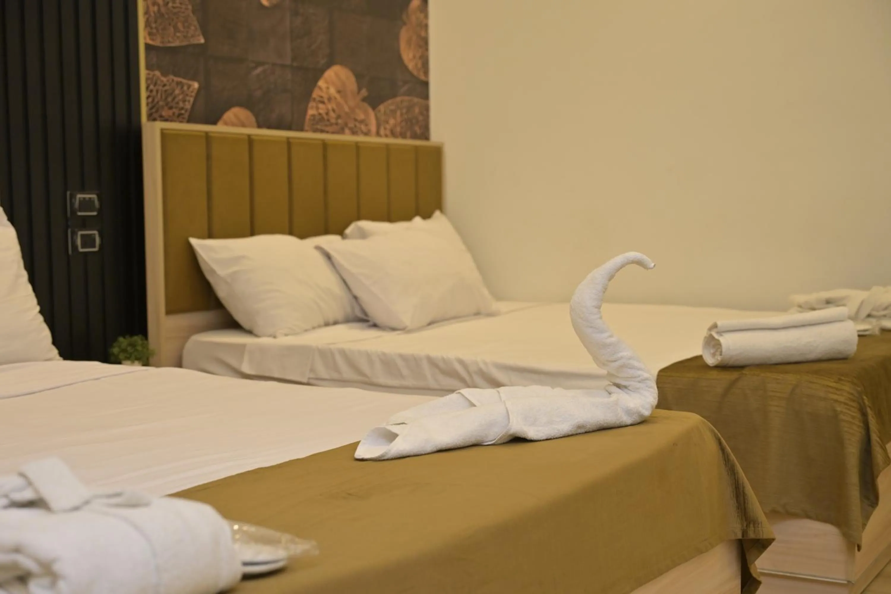 Bed in Palm Pyramids View INN