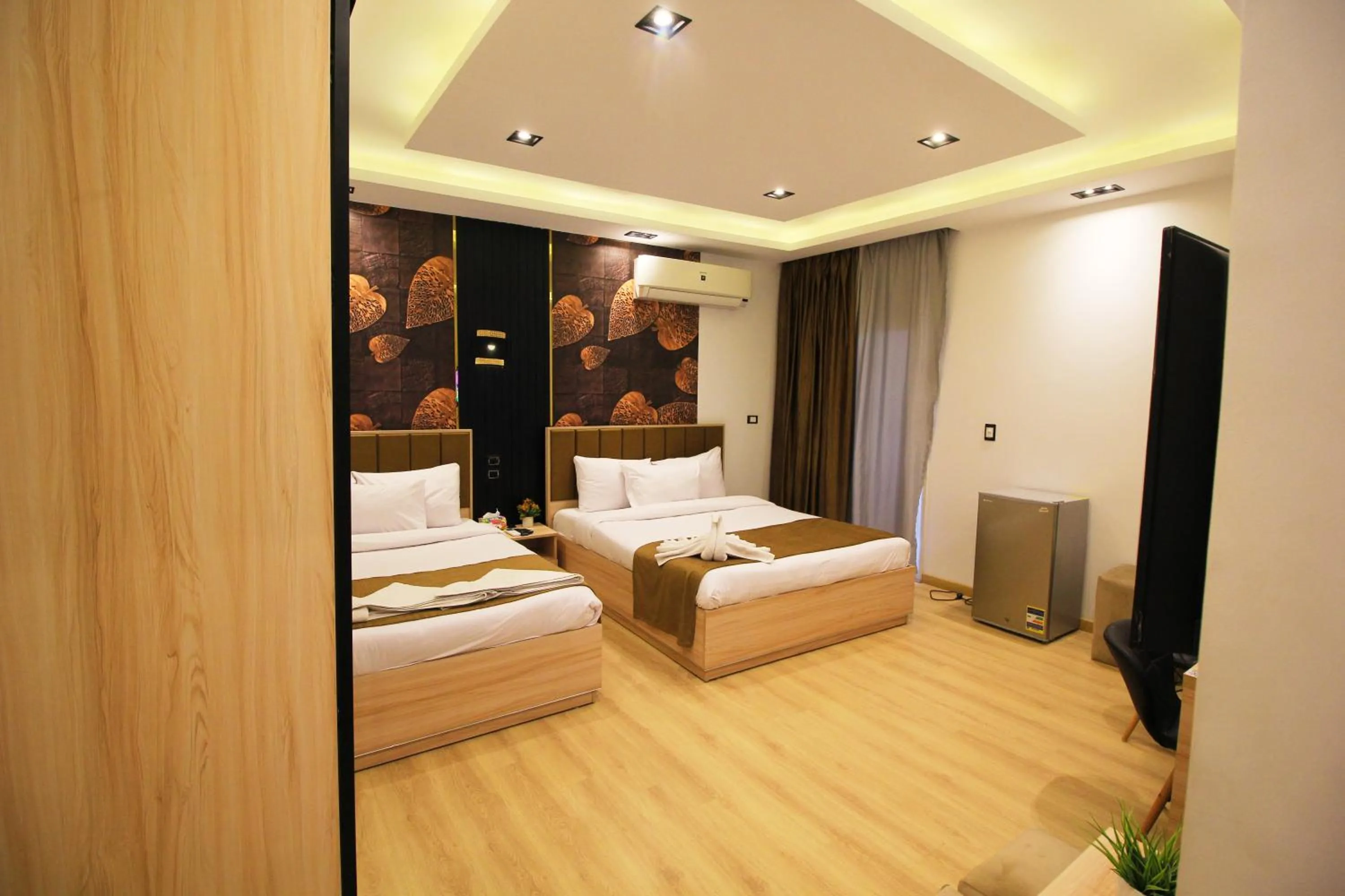 Bed in Palm Pyramids View INN
