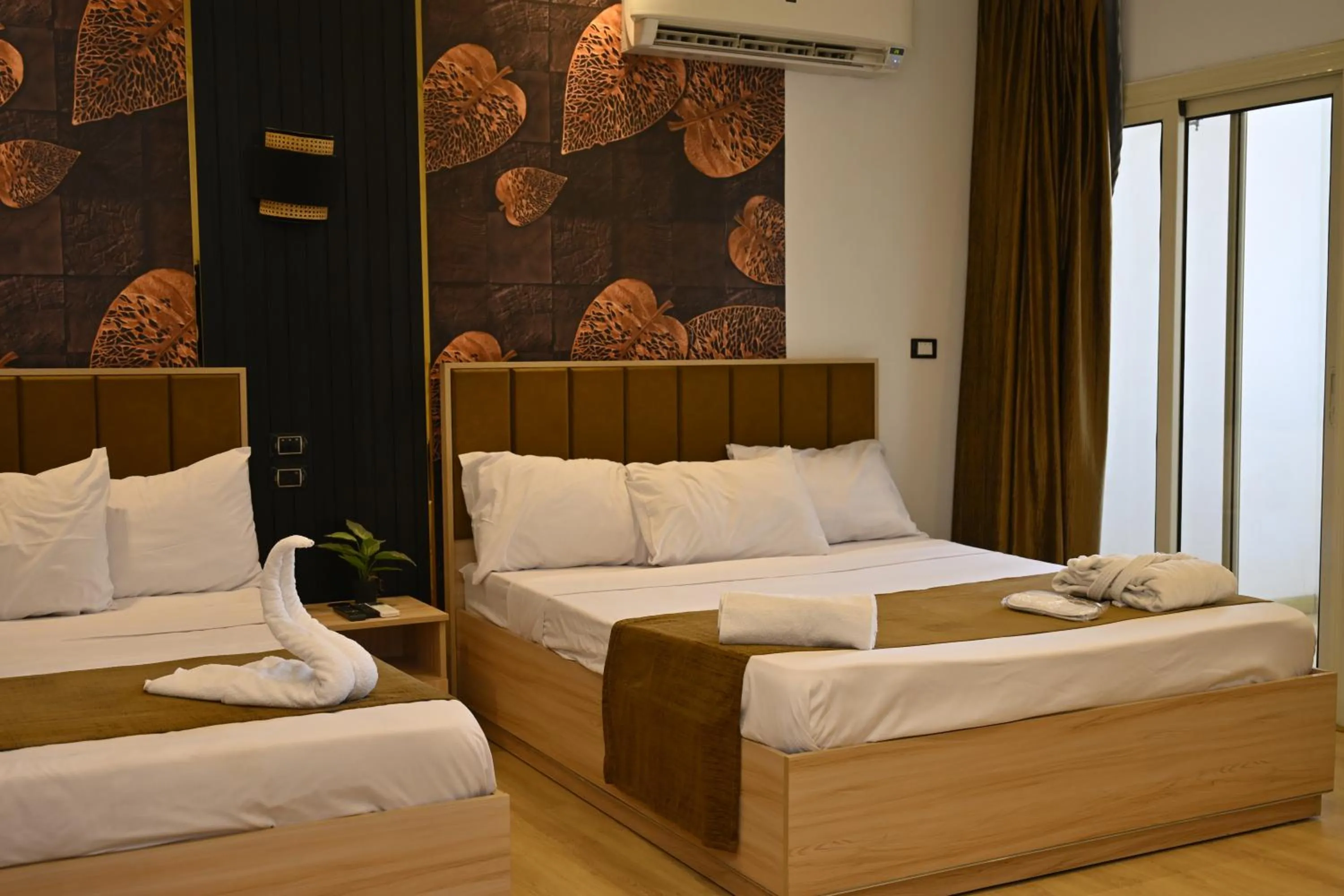 Bed in Palm Pyramids View INN