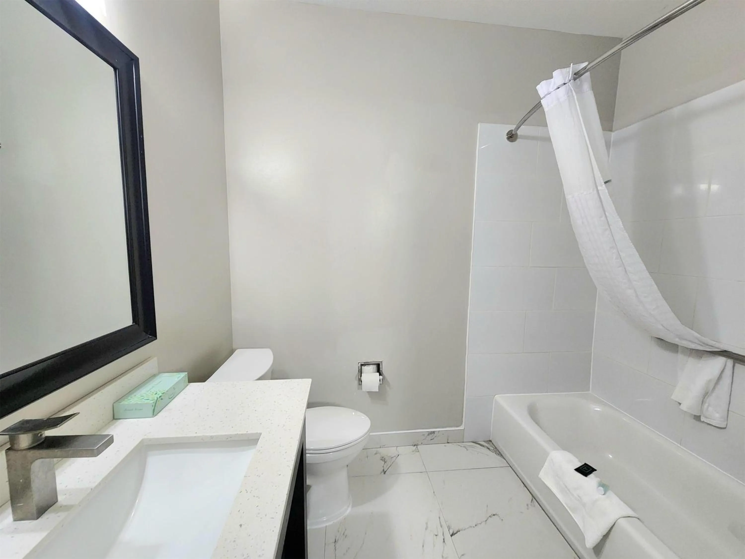 Bathroom in Days Inn & Suites by Wyndham Corpus Christi Central