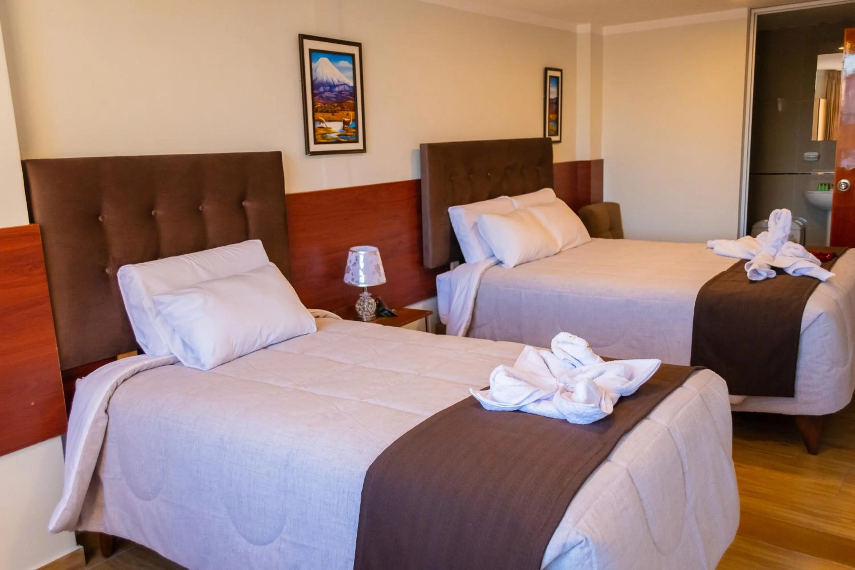 towels, Bed in Hostal Samakuy AQP
