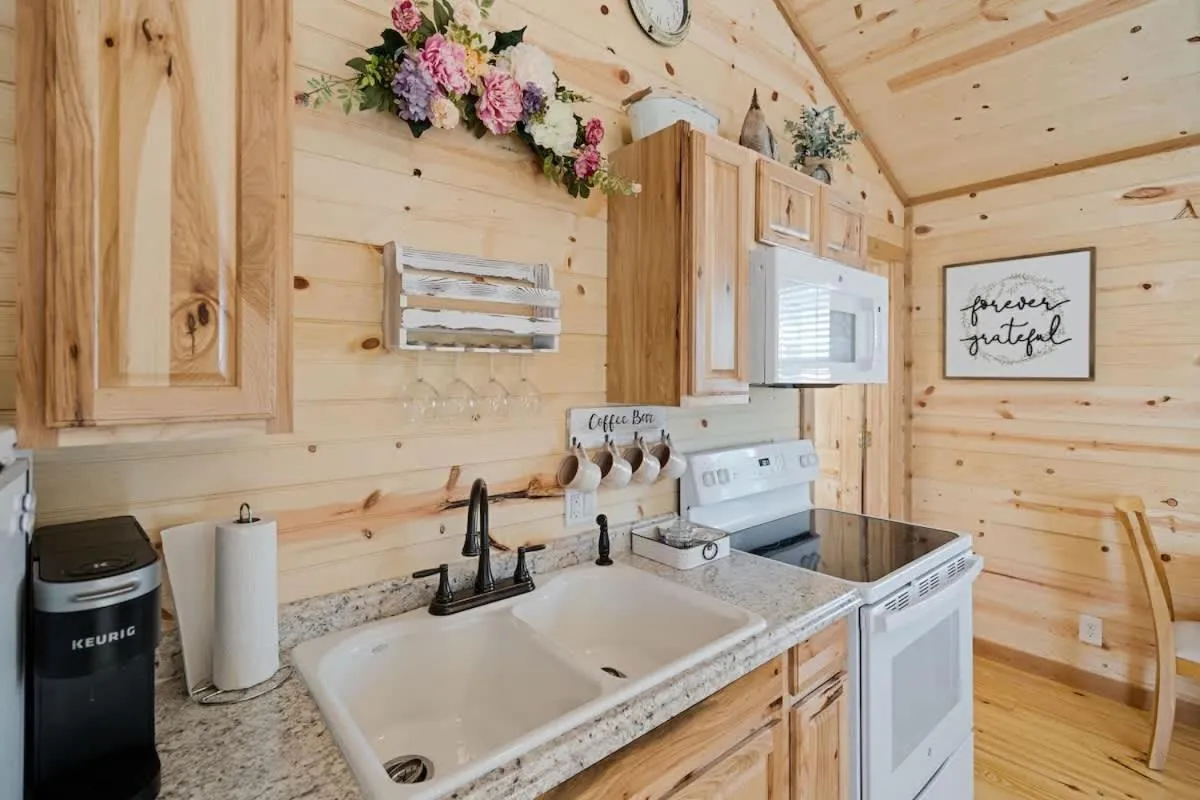 Kitchen or kitchenette in Fancy Cabin Right on Main St!