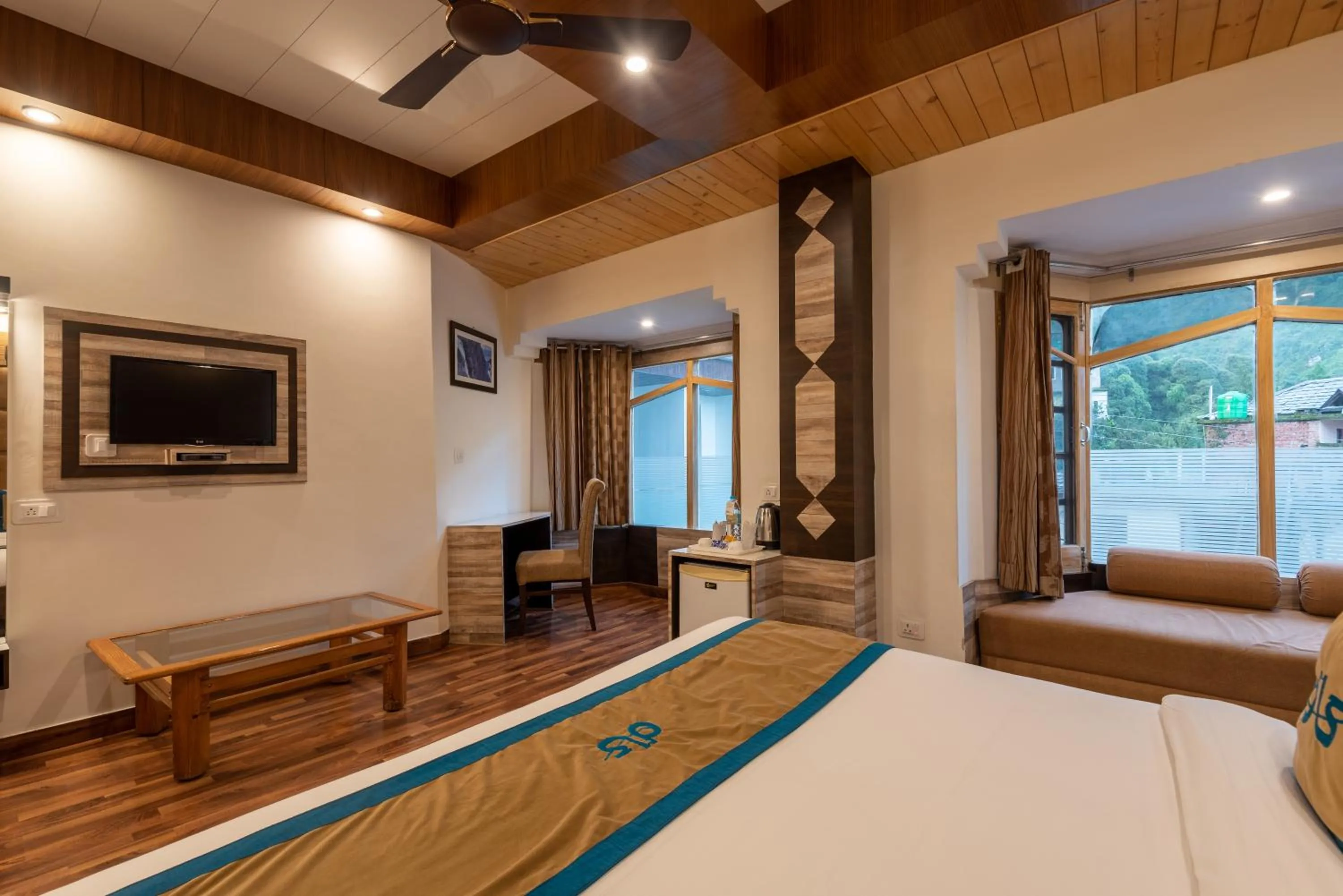 Bed in Meghavan Resort By DLS Hotels