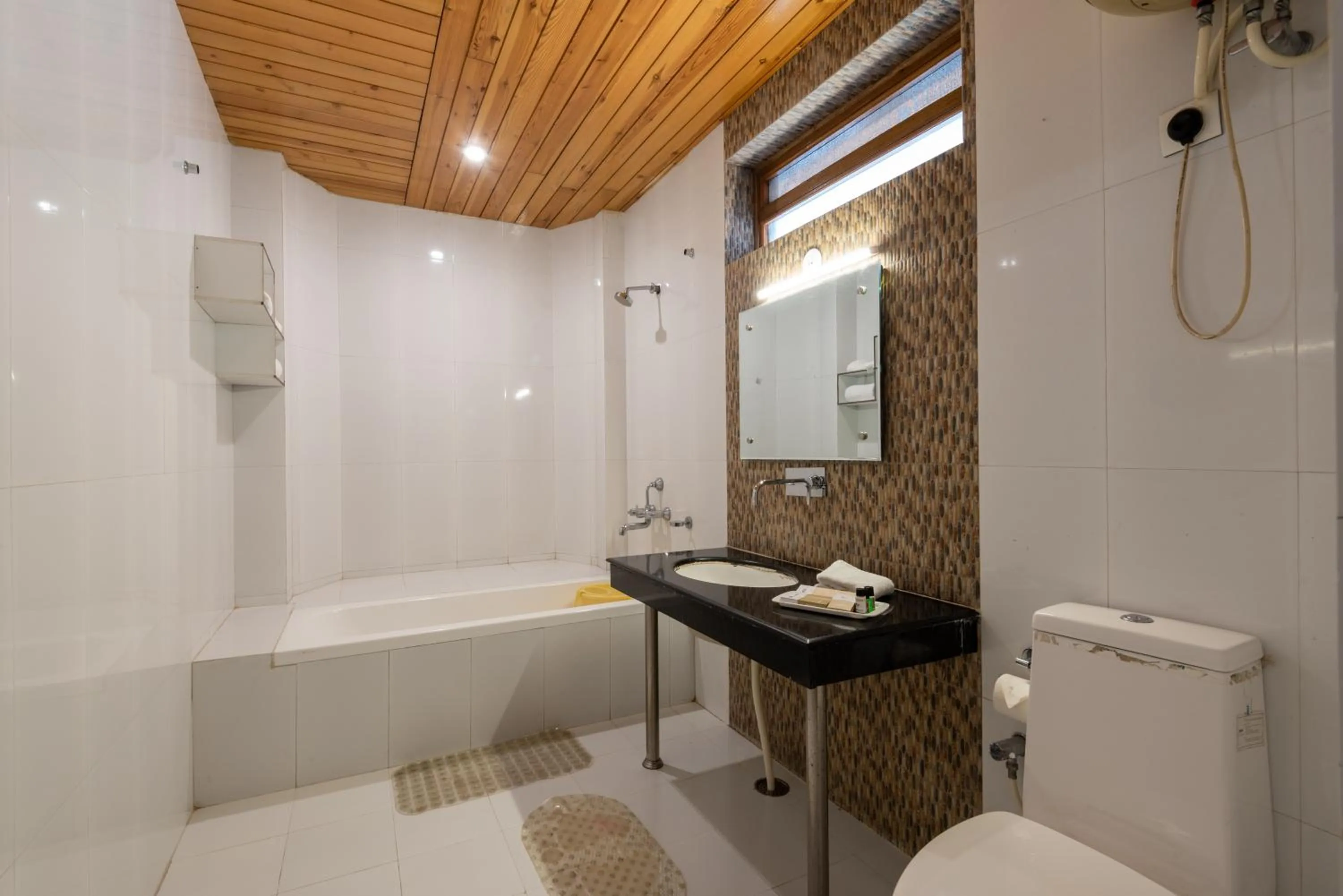 Shower, Bathroom in Meghavan Resort By DLS Hotels