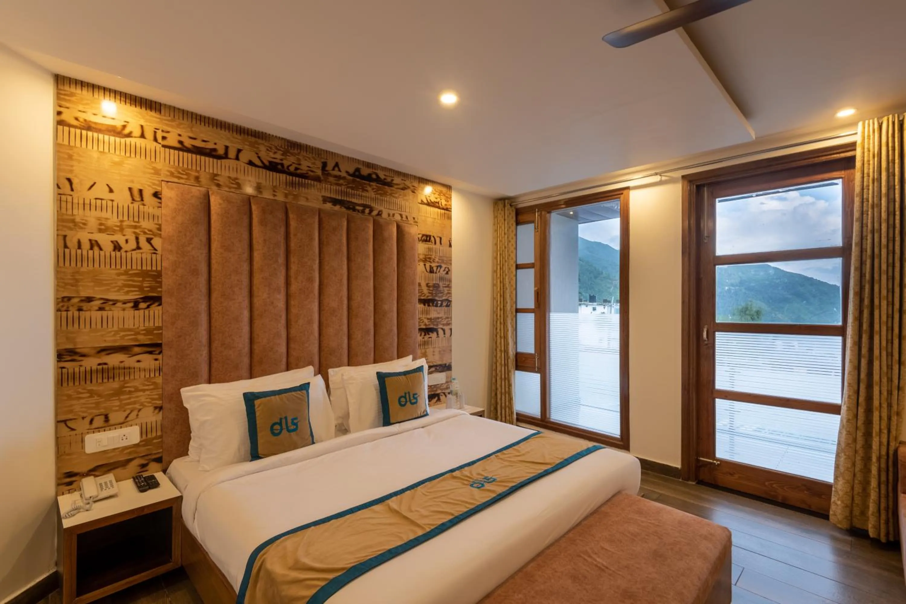 Bed in Meghavan Resort By DLS Hotels