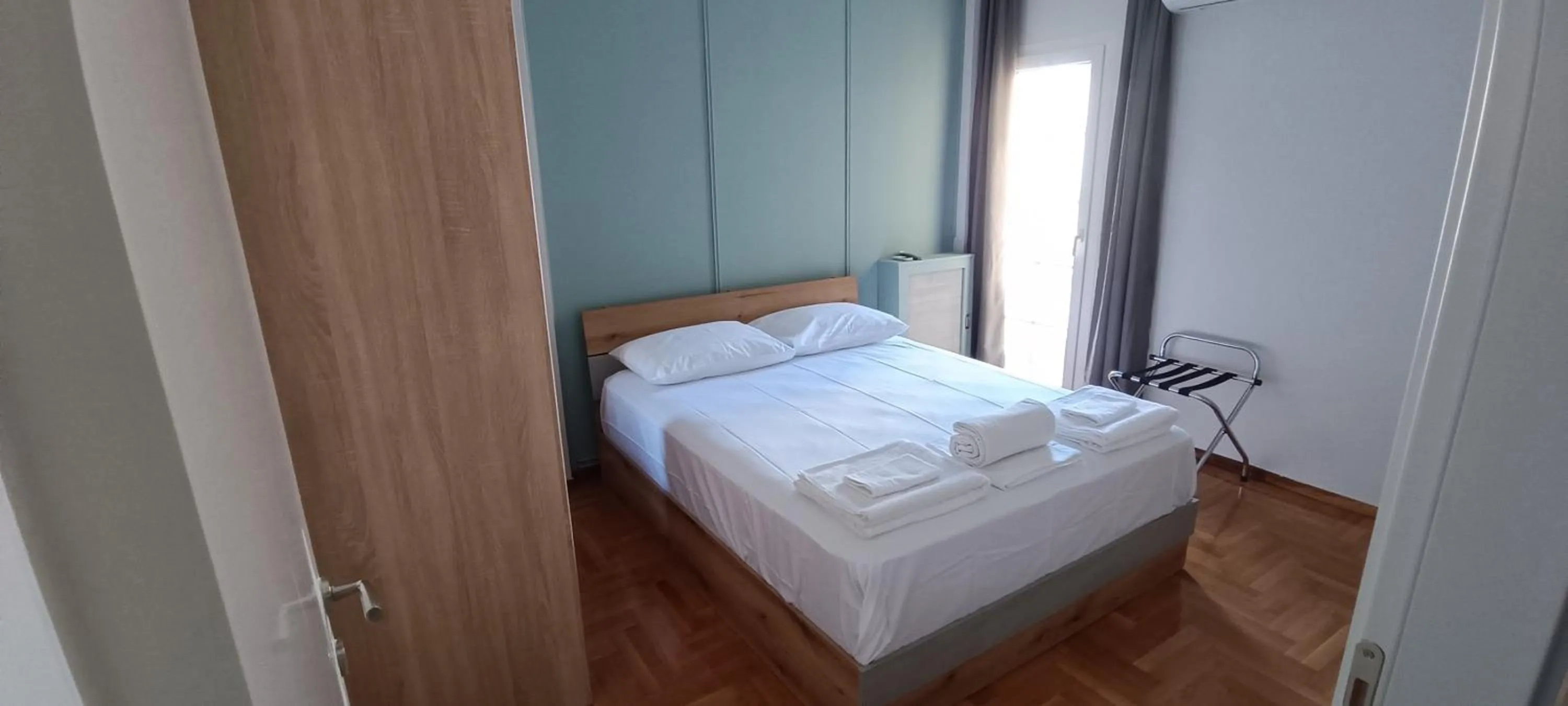 Bed in Artemis Plaza Suites