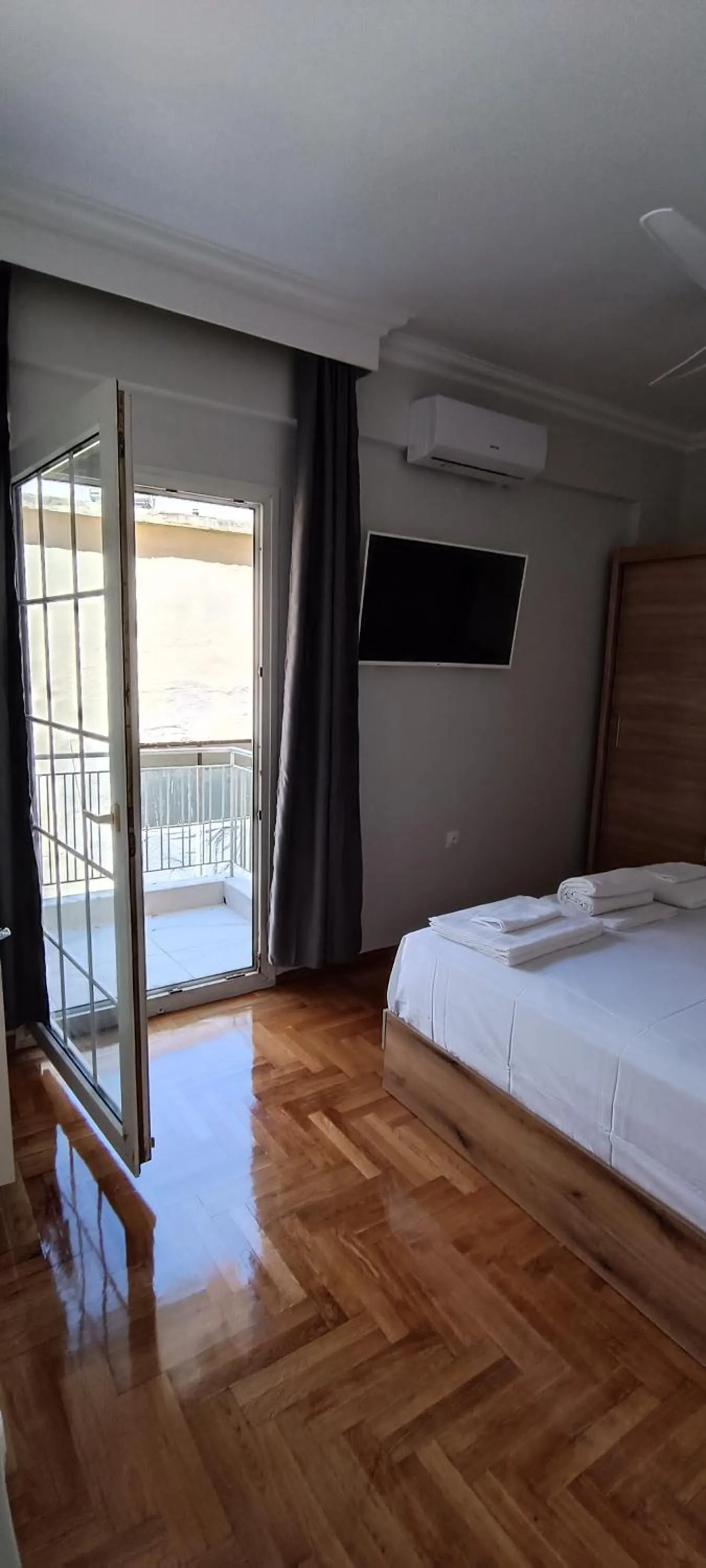 Bed in Artemis Plaza Suites