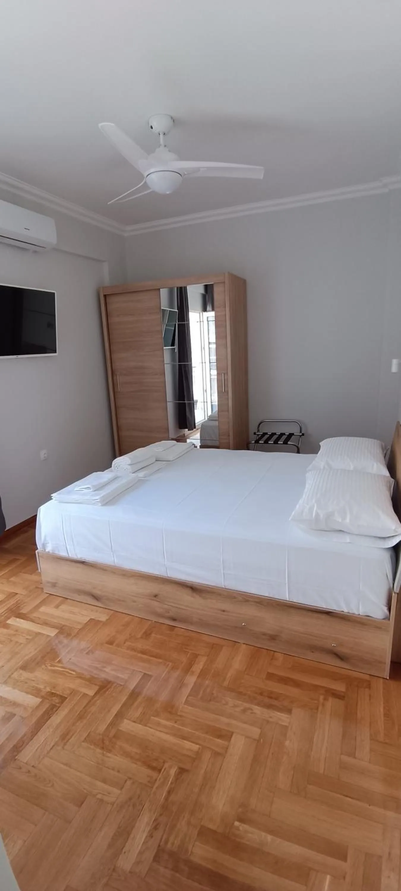 Bed in Artemis Plaza Suites