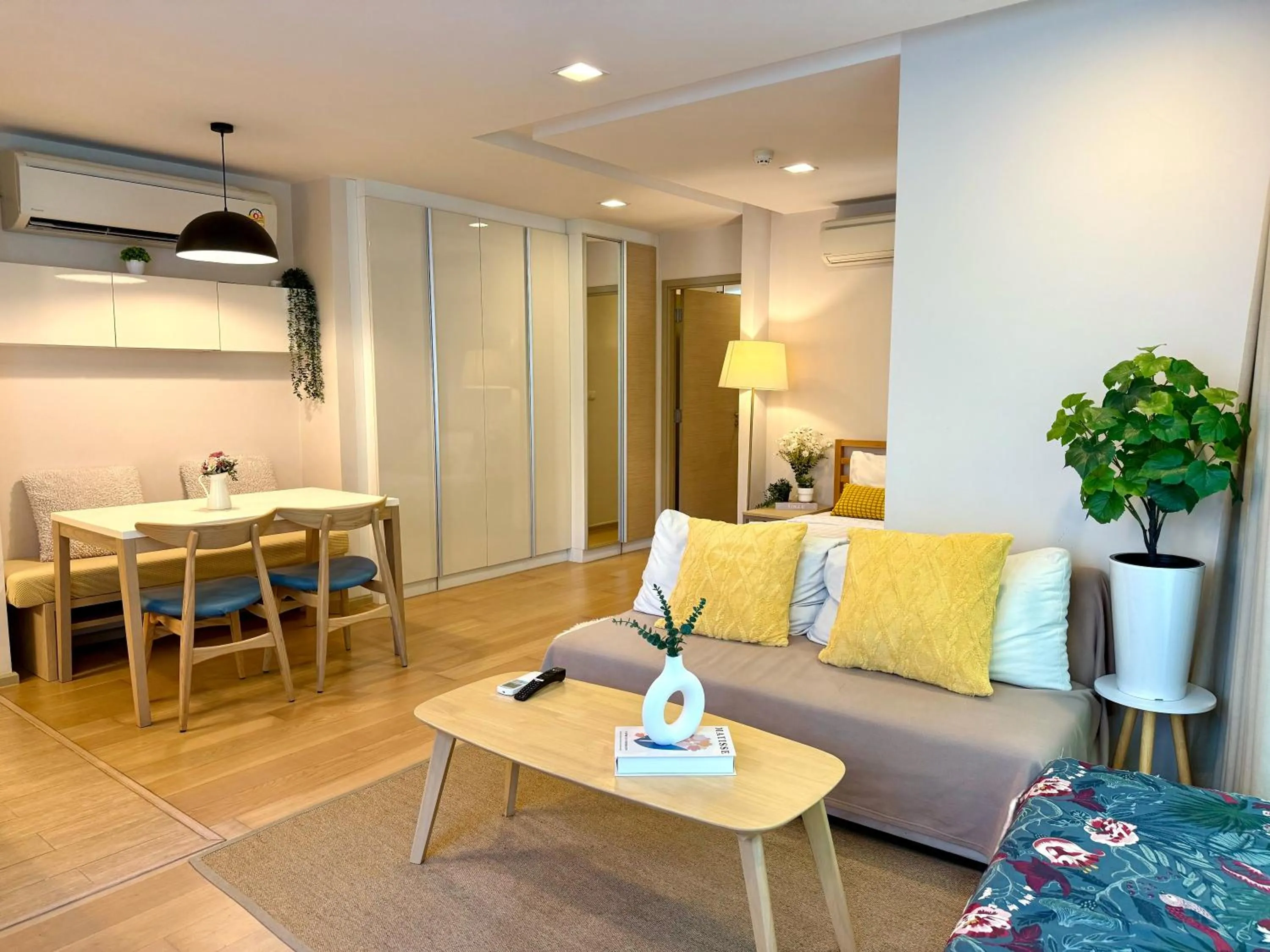 Living room in Cozy Spacious 1BR 2Bed GardenView 500m BTS Thonglo, Samitivej, SKV49, Rooftop Pool, Fast 500mbps wifi