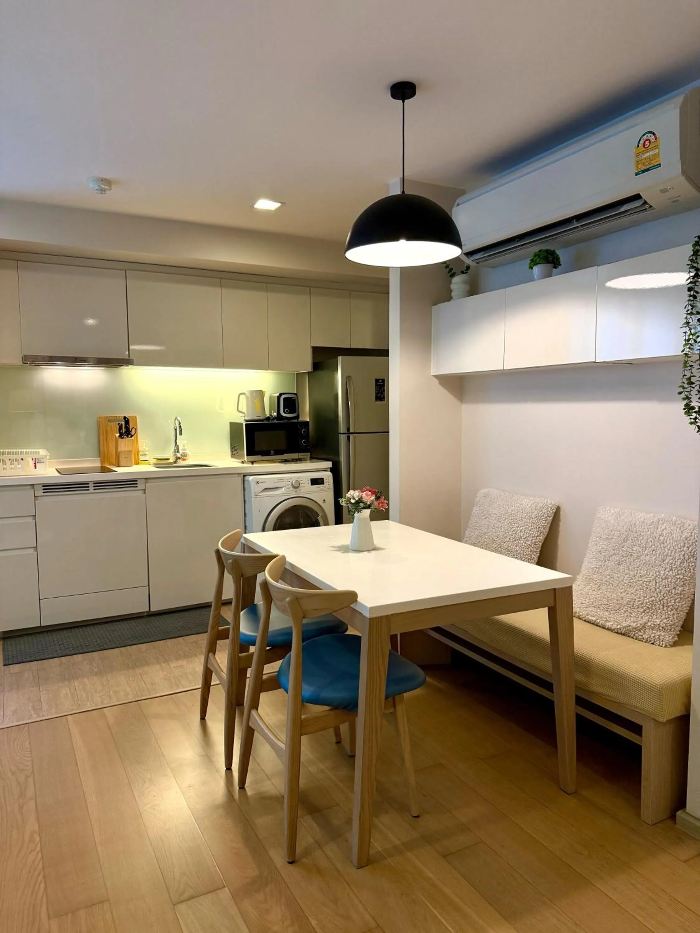 Living room in Cozy Spacious 1BR 2Bed GardenView 500m BTS Thonglo, Samitivej, SKV49, Rooftop Pool, Fast 500mbps wifi