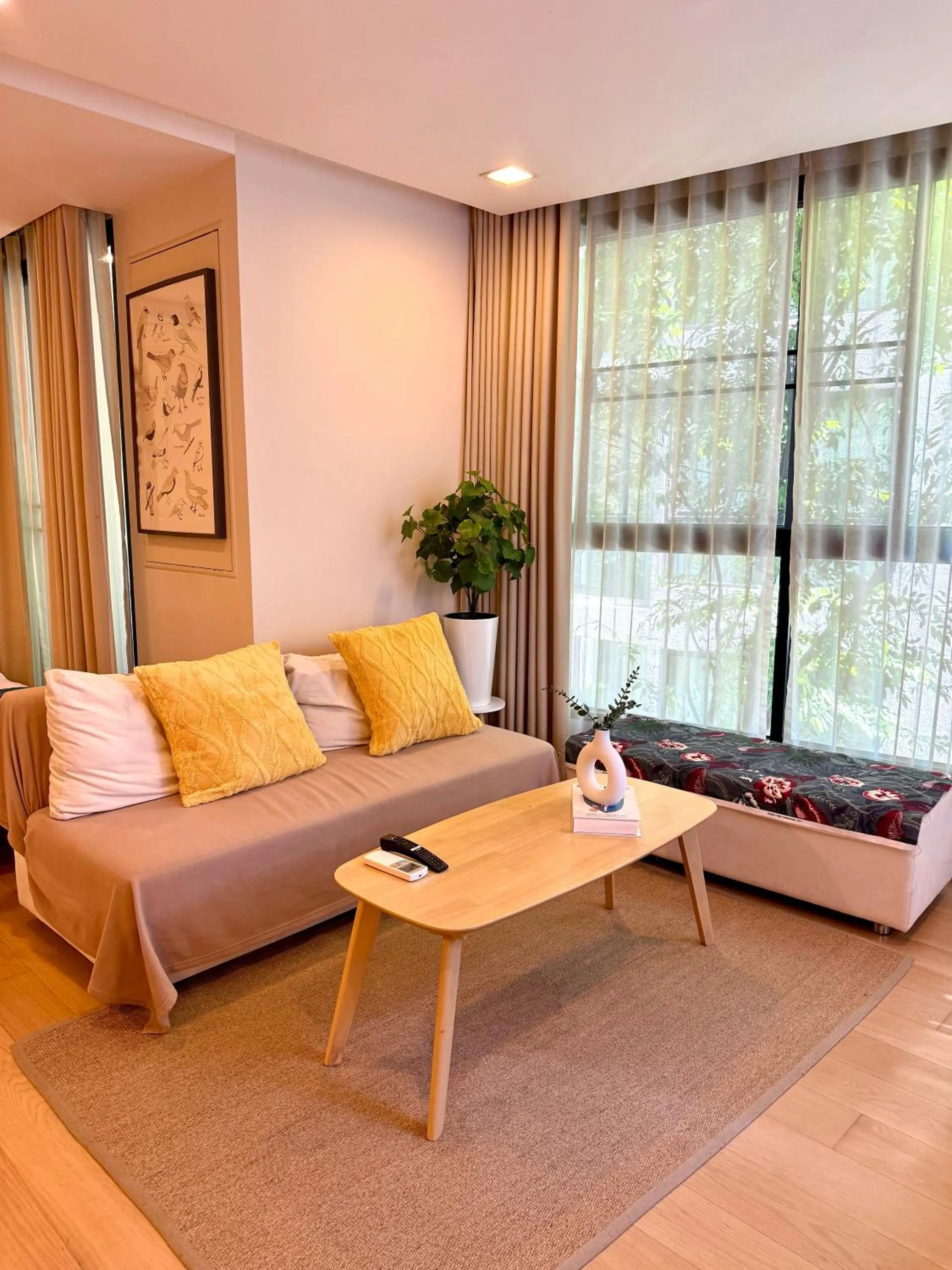 Living room in Cozy Spacious 1BR 2Bed GardenView 500m BTS Thonglo, Samitivej, SKV49, Rooftop Pool, Fast 500mbps wifi