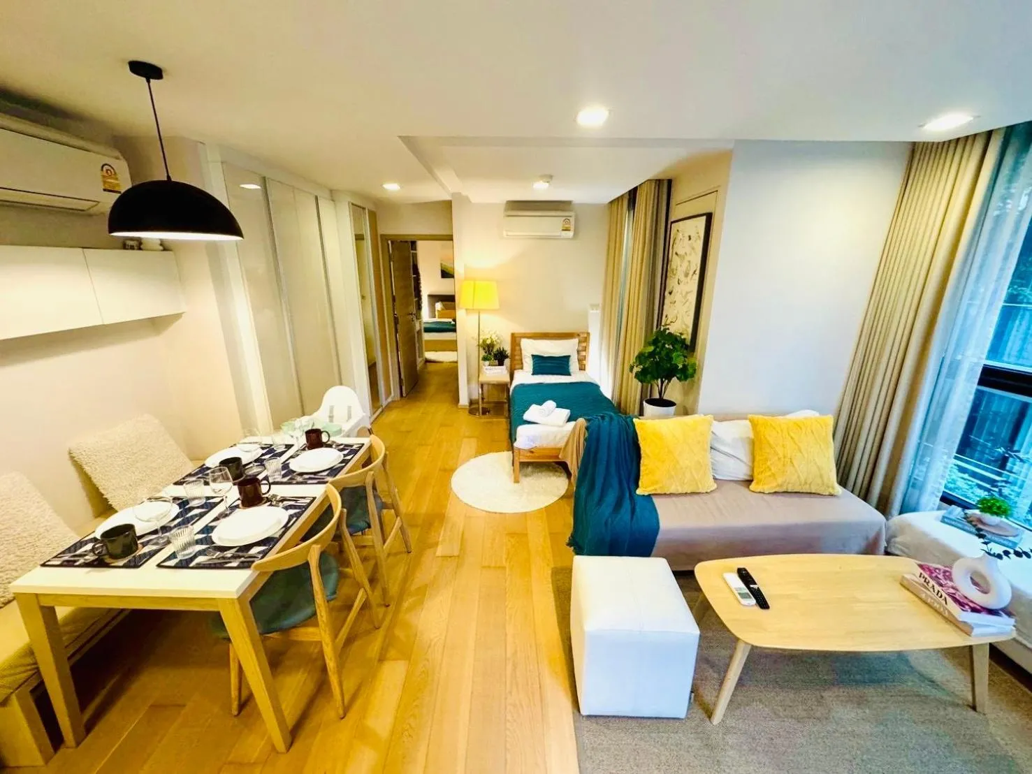 Living room in Cozy Spacious 1BR 2Bed GardenView 500m BTS Thonglo, Samitivej, SKV49, Rooftop Pool, Fast 500mbps wifi