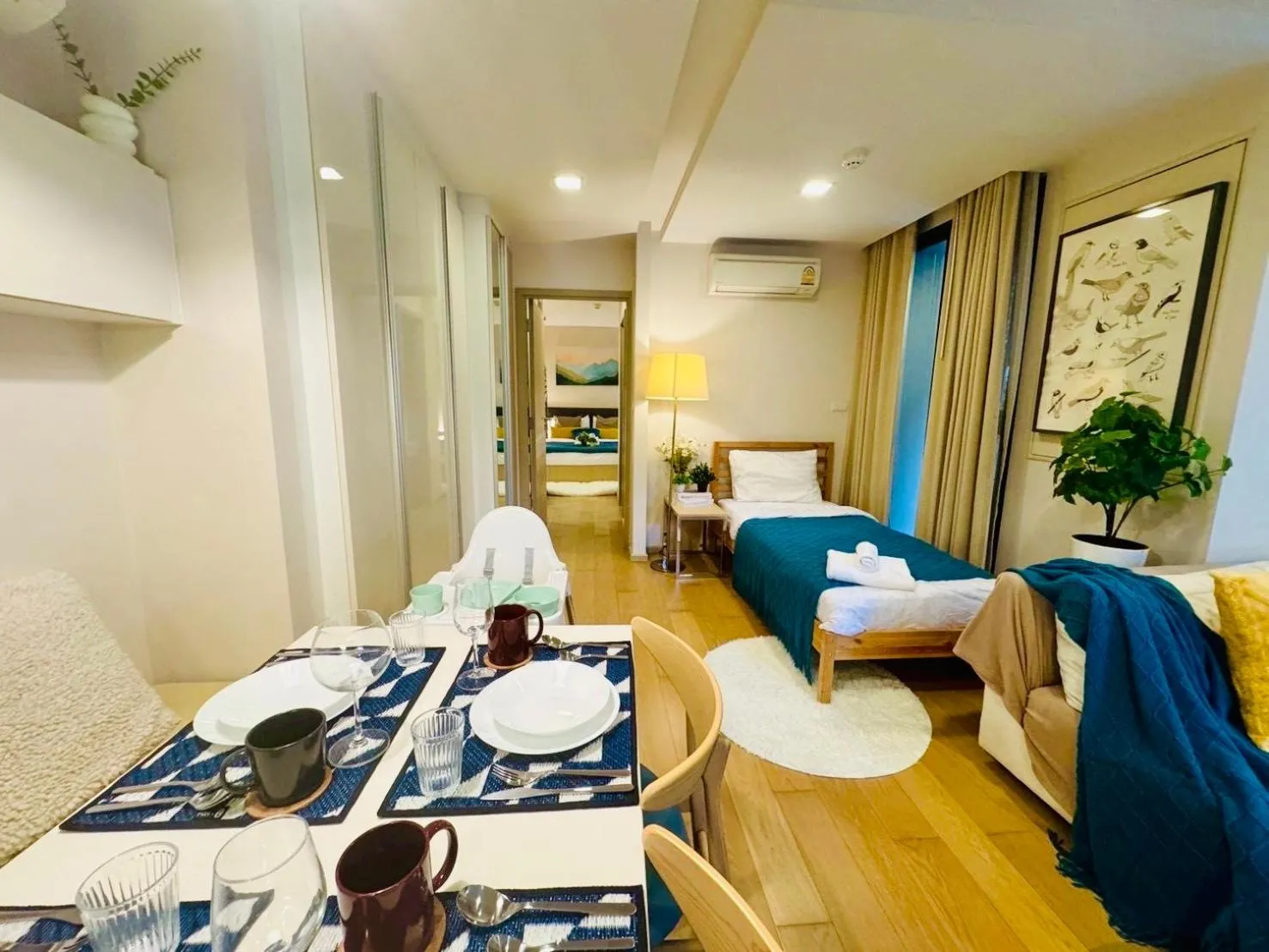 Living room in Cozy Spacious 1BR 2Bed GardenView 500m BTS Thonglo, Samitivej, SKV49, Rooftop Pool, Fast 500mbps wifi