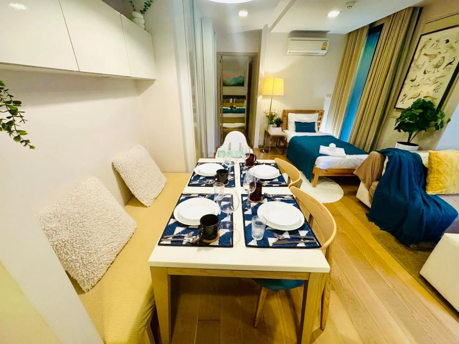 Living room in Cozy Spacious 1BR 2Bed GardenView 500m BTS Thonglo, Samitivej, SKV49, Rooftop Pool, Fast 500mbps wifi