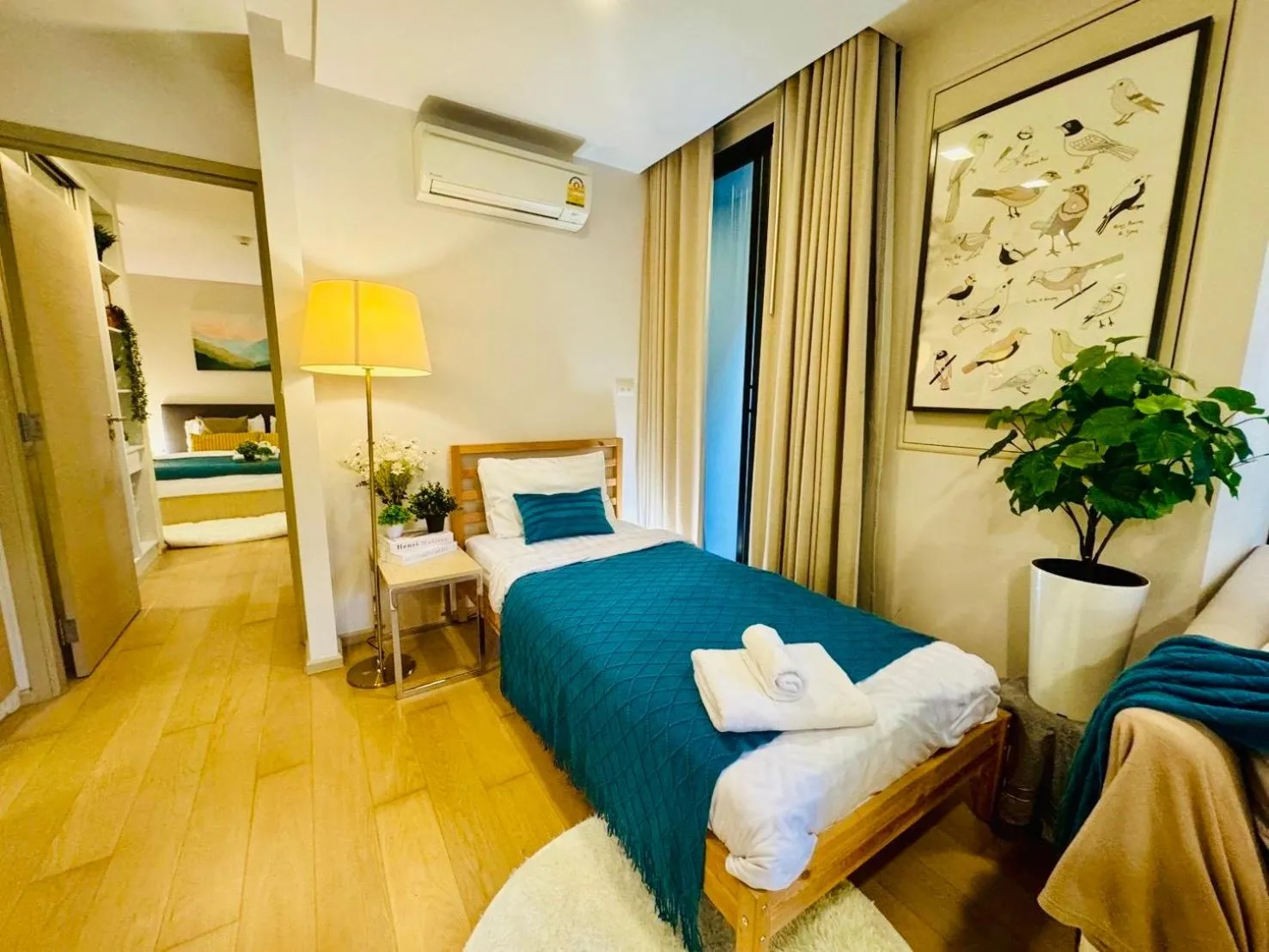 Bed in Cozy Spacious 1BR 2Bed GardenView 500m BTS Thonglo, Samitivej, SKV49, Rooftop Pool, Fast 500mbps wifi