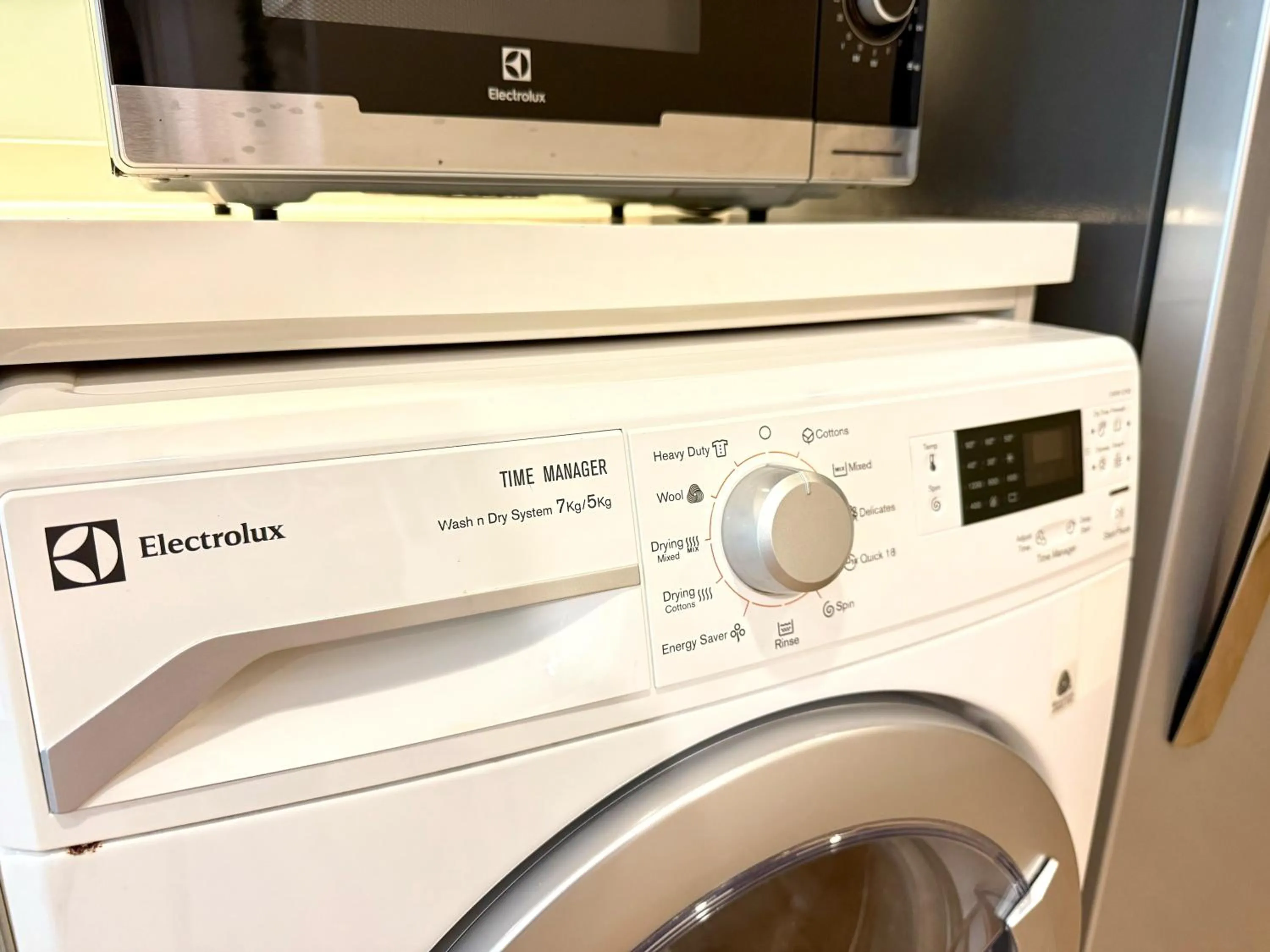 washing machine in Cozy Spacious 1BR 2Bed GardenView 500m BTS Thonglo, Samitivej, SKV49, Rooftop Pool, Fast 500mbps wifi