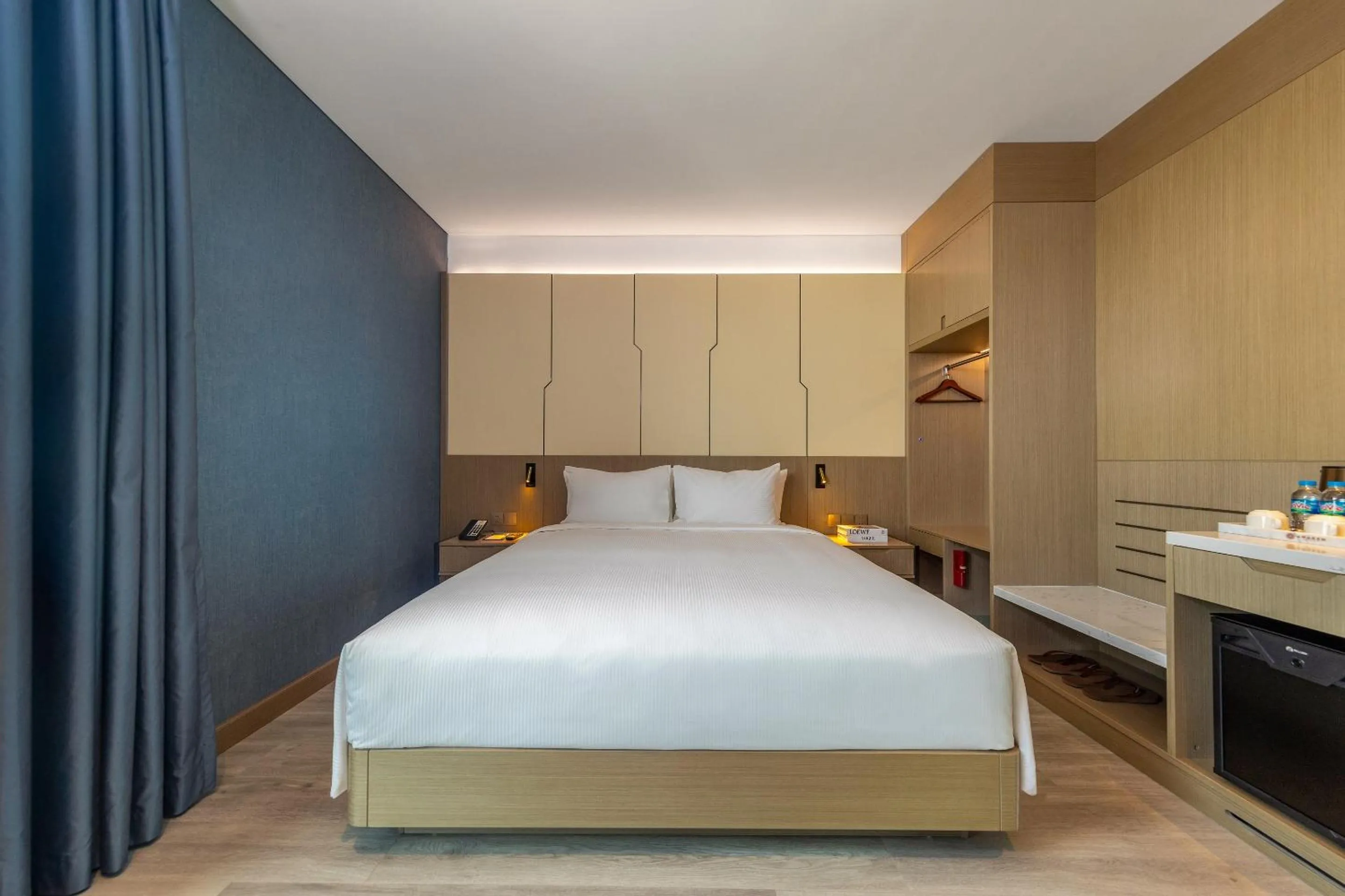 Bed in Awaken Da Nang Hotel