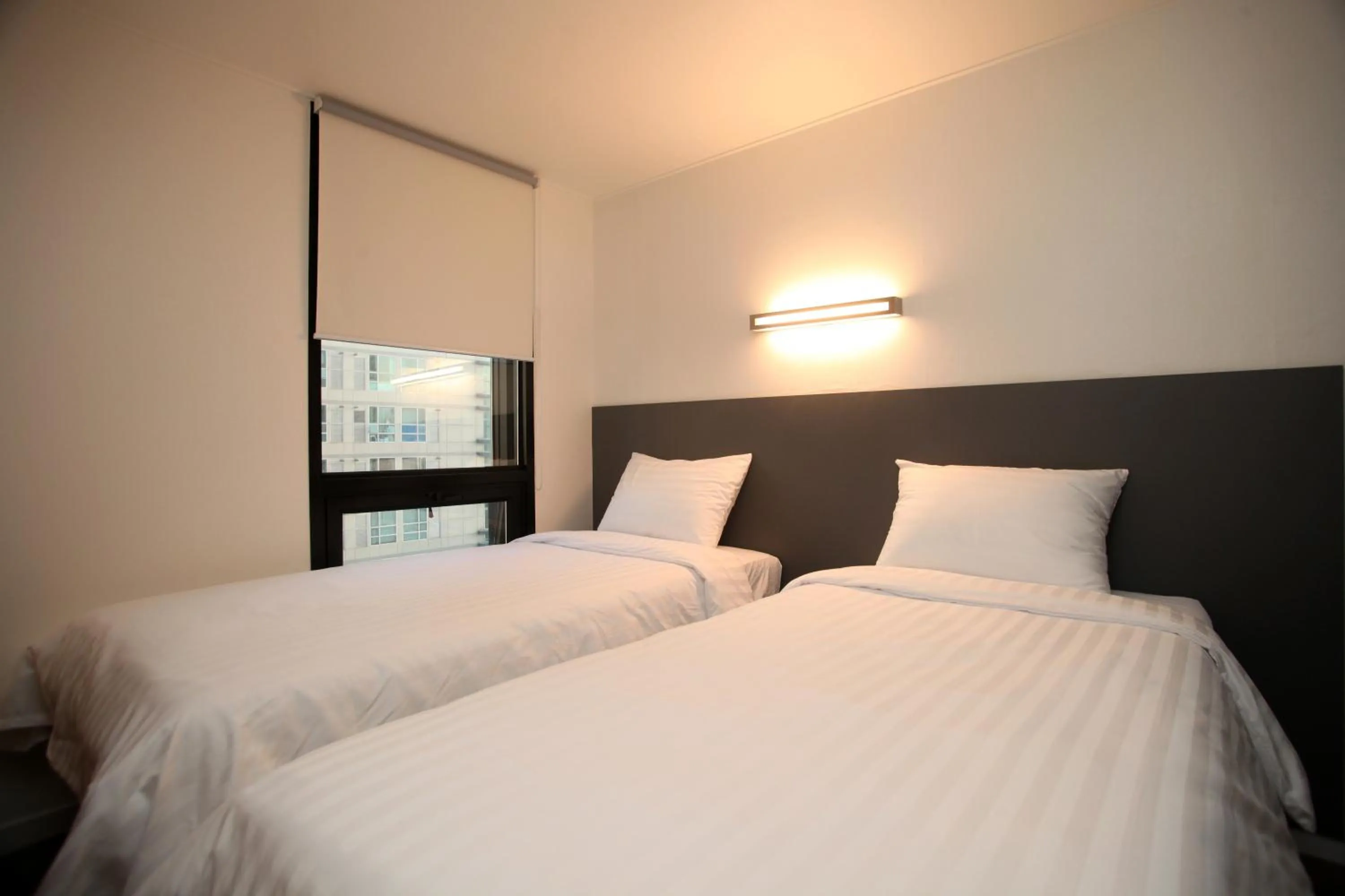 Photo of the whole room, Bed in KSTAR METRO Hotel